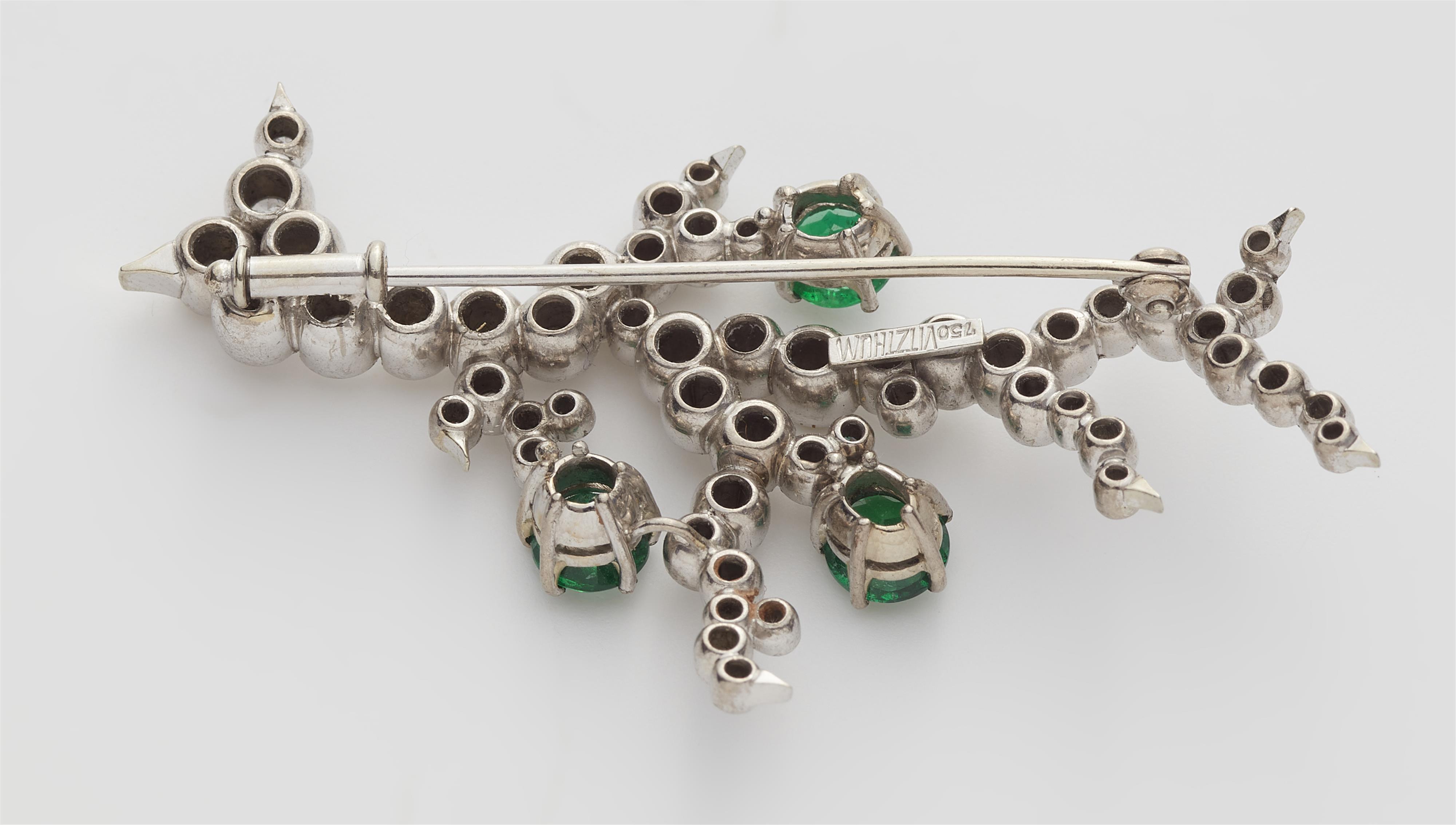 A German 18k gold diamond and emerald flower brooch. - image-4