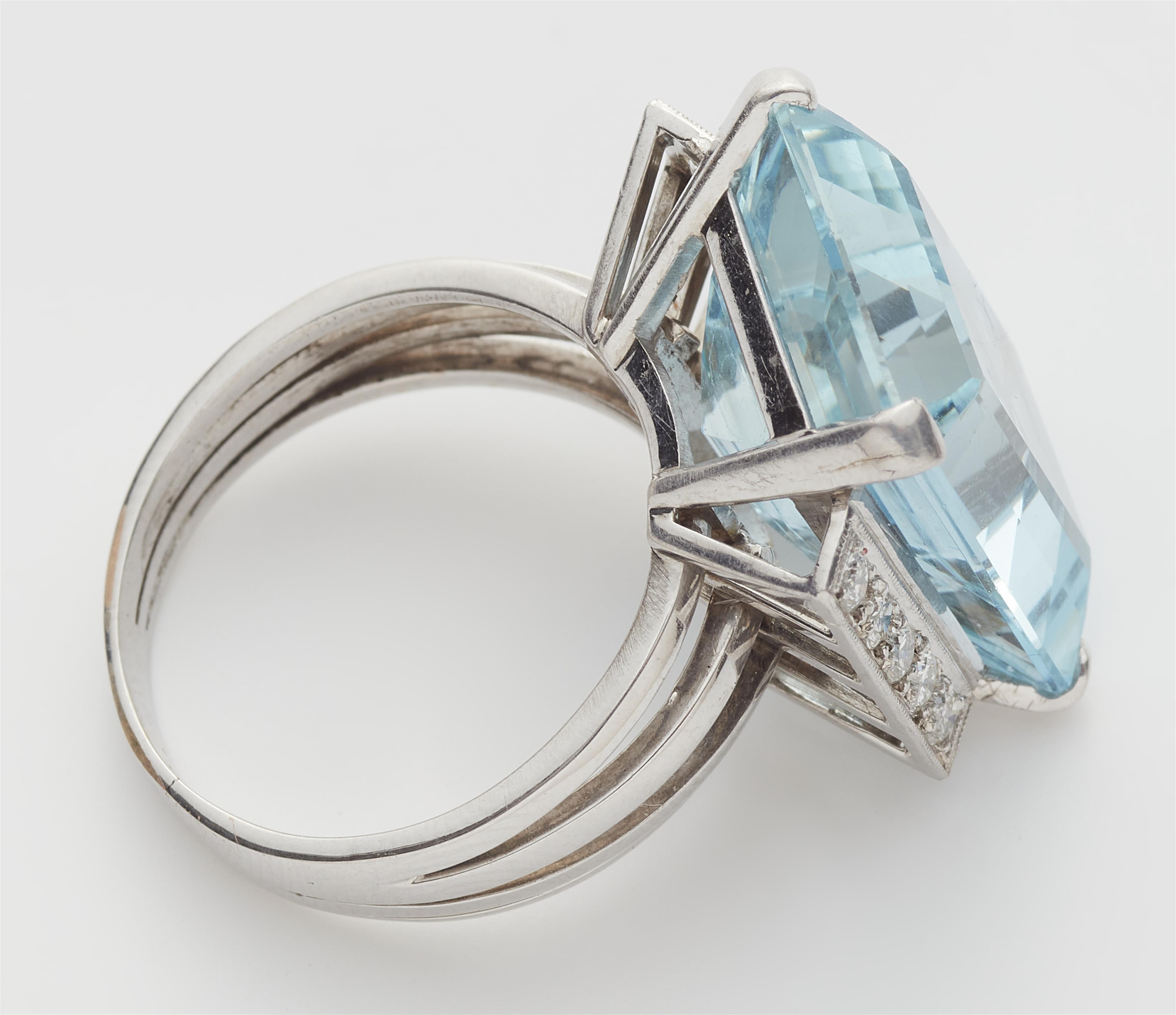 An 18k gold diamond and step-cut aquamarine cocktail ring. - image-2