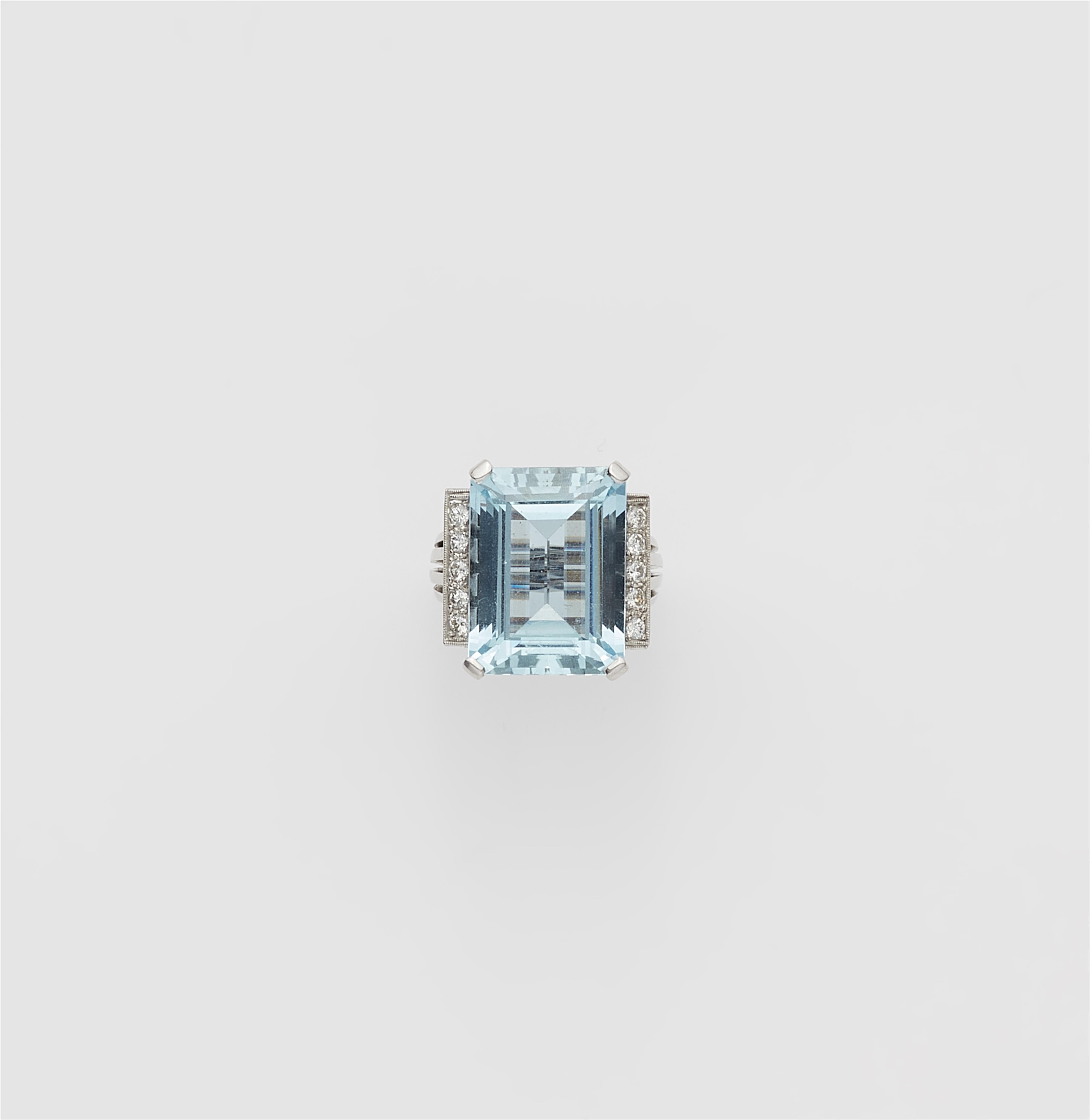 An 18k gold diamond and step-cut aquamarine cocktail ring. - image-1