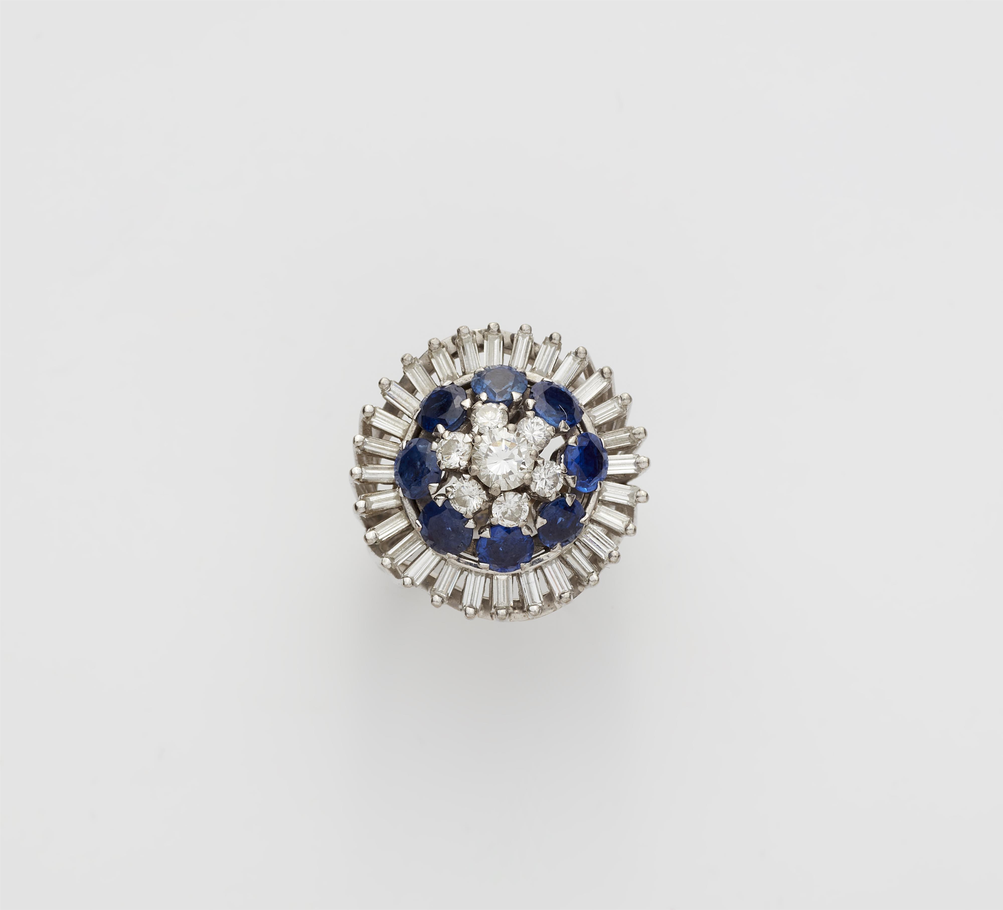 An 18k white gold diamond and sapphire cocktail ring. - image-1