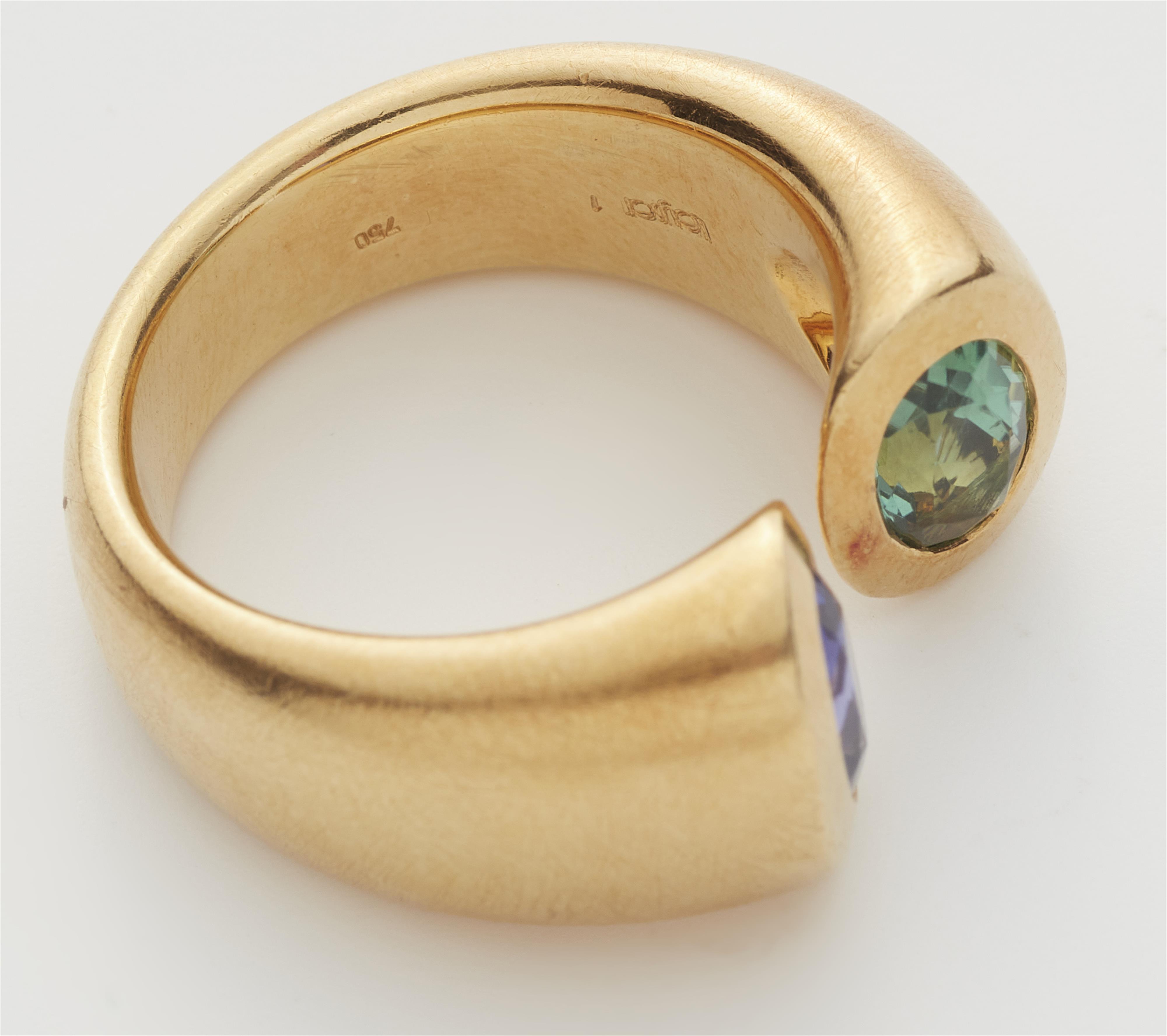 A Belgian 18k gold tanzanite and green tourmaline toi-et-moi ring. - image-2