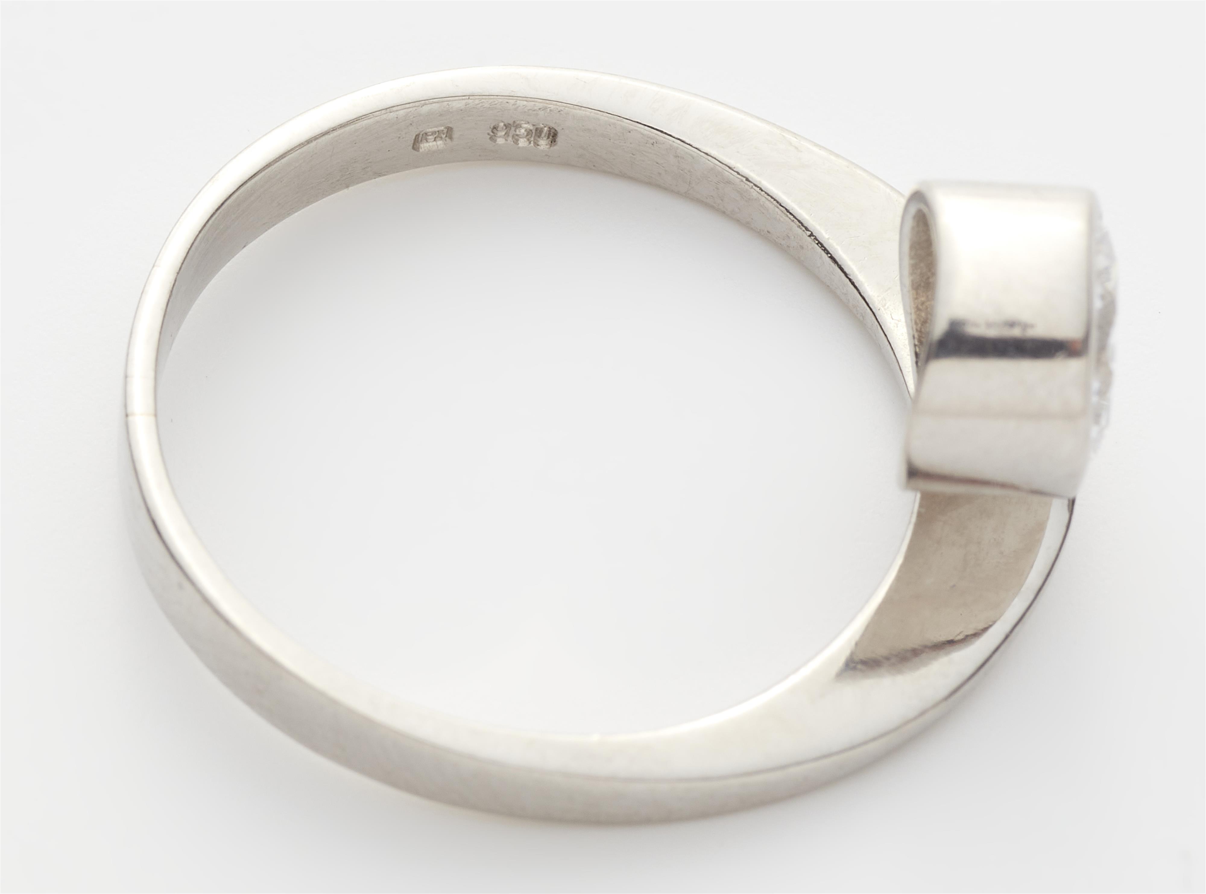 A platinum and c. 1.07 ct brilliant-cut diamond solitaire ring. - image-2