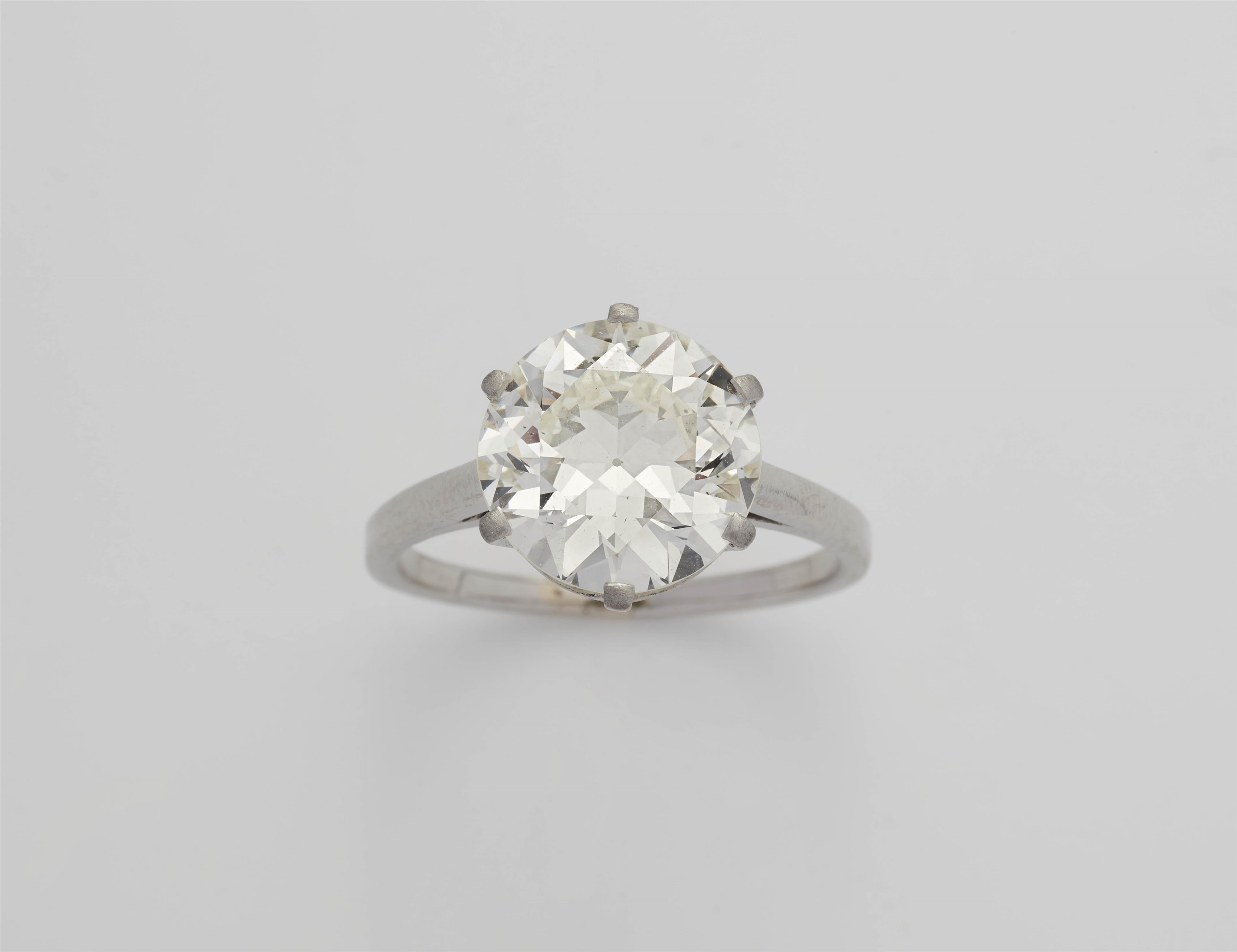 A 14k white gold and diamond solitaire ring. - image-3