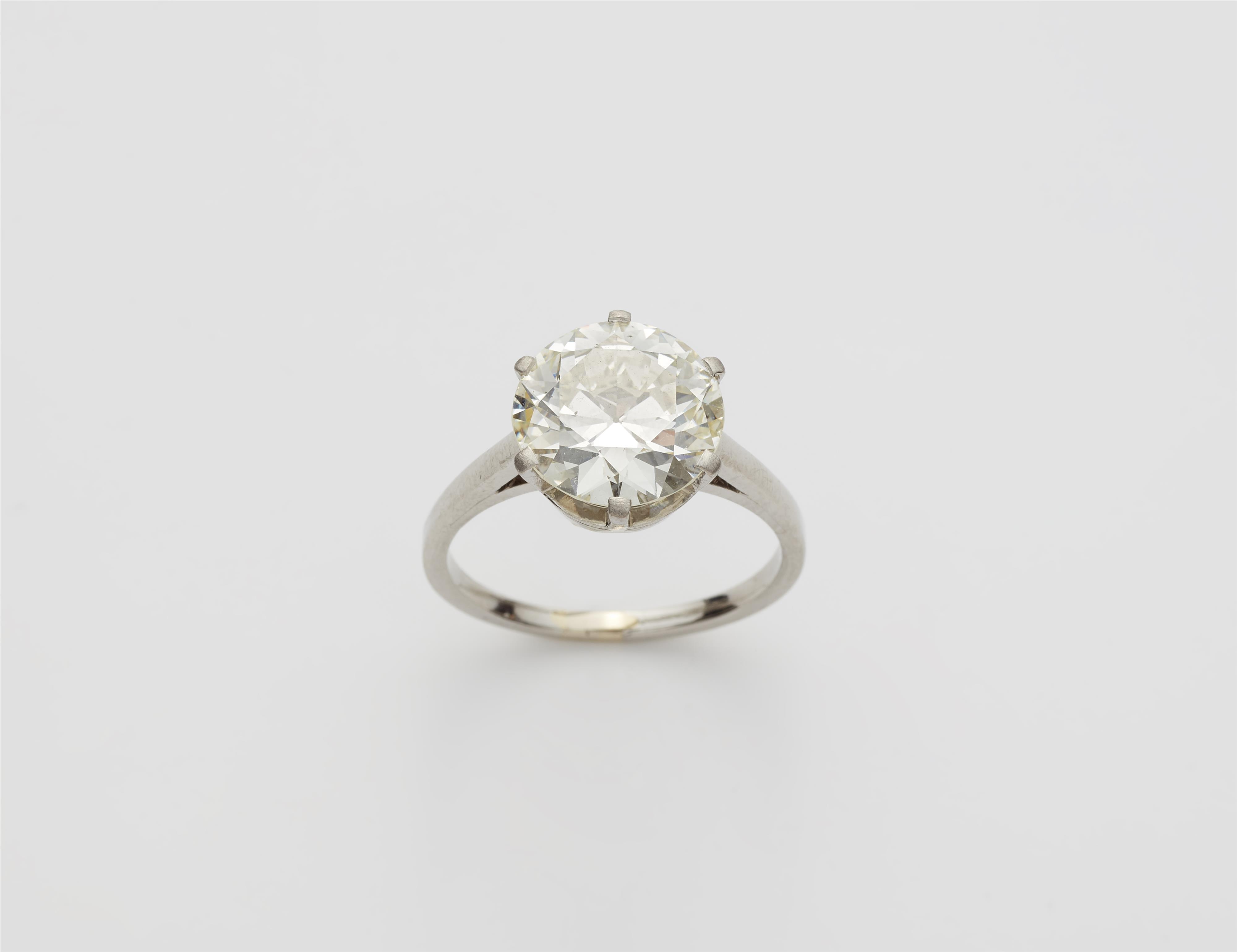 A 14k white gold and diamond solitaire ring. - image-1