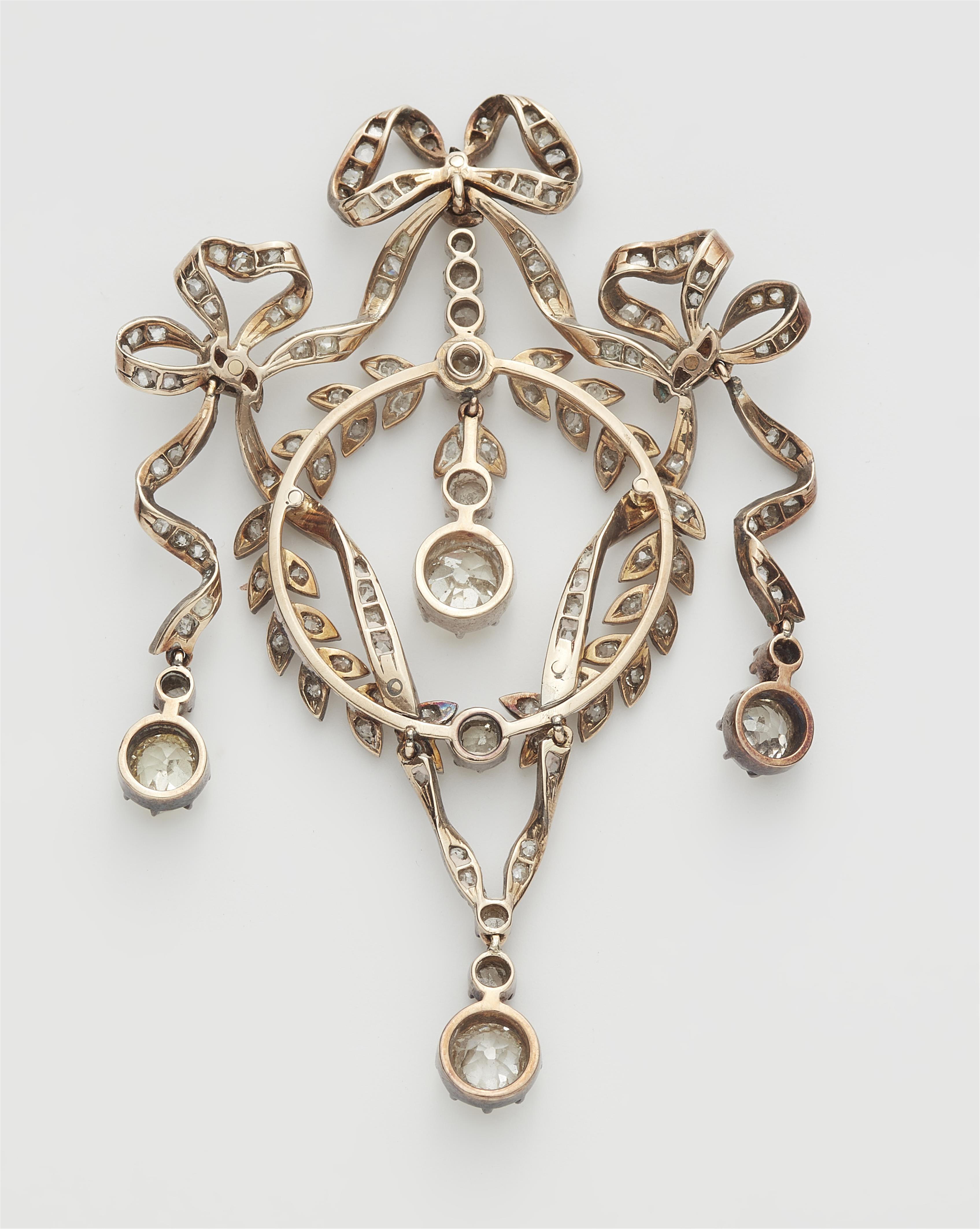 An Edwardian silver 14k gold and diamond garland pendant with original case. Mountings lost. - image-2