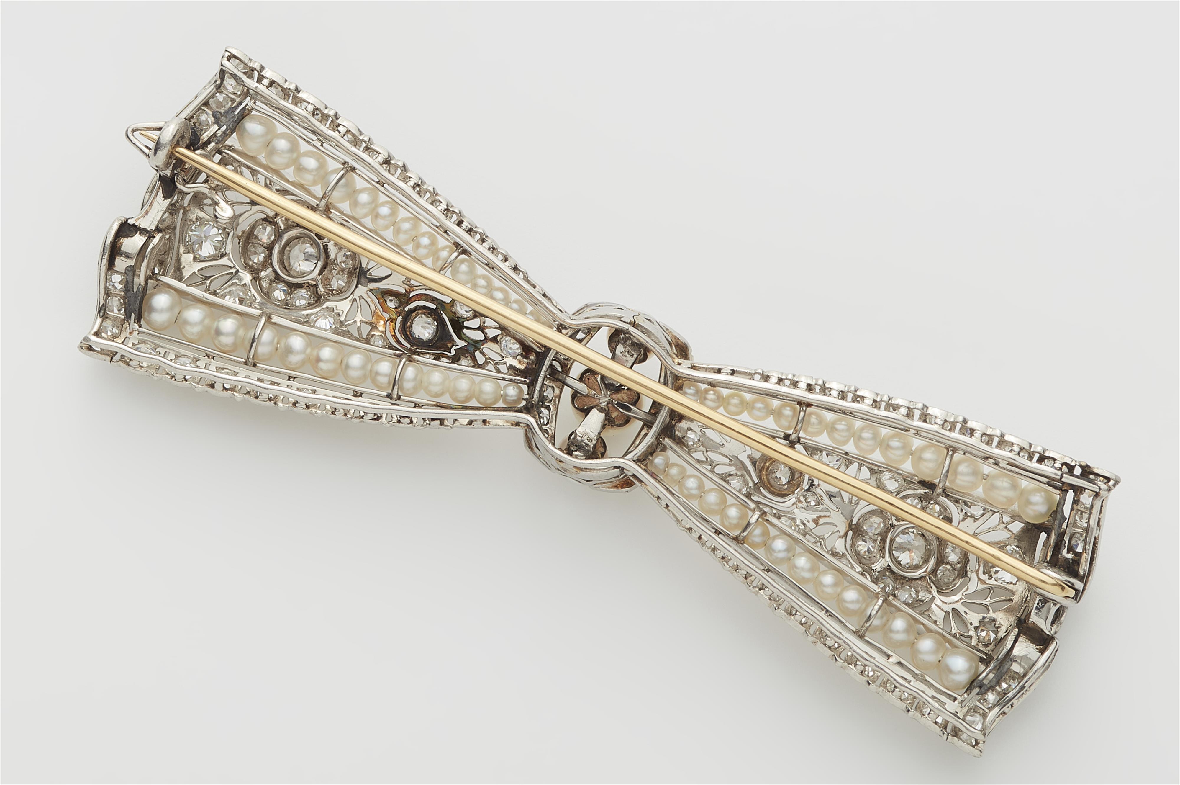 A Belle Epoque platinum diamond and pearl bow brooch. - image-2