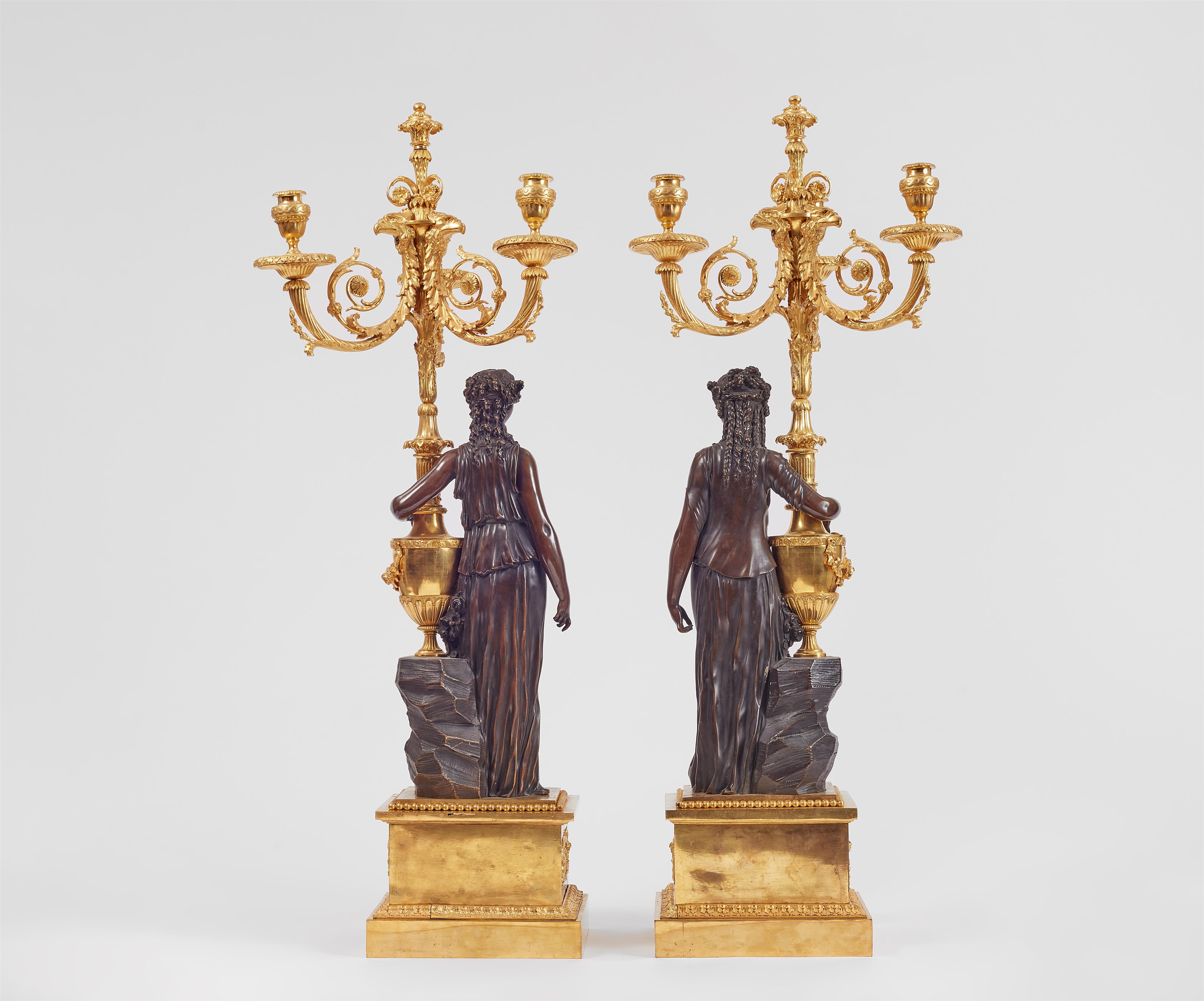 A pair of sculptural ormolu candelabra
after a model by Clodion - image-2