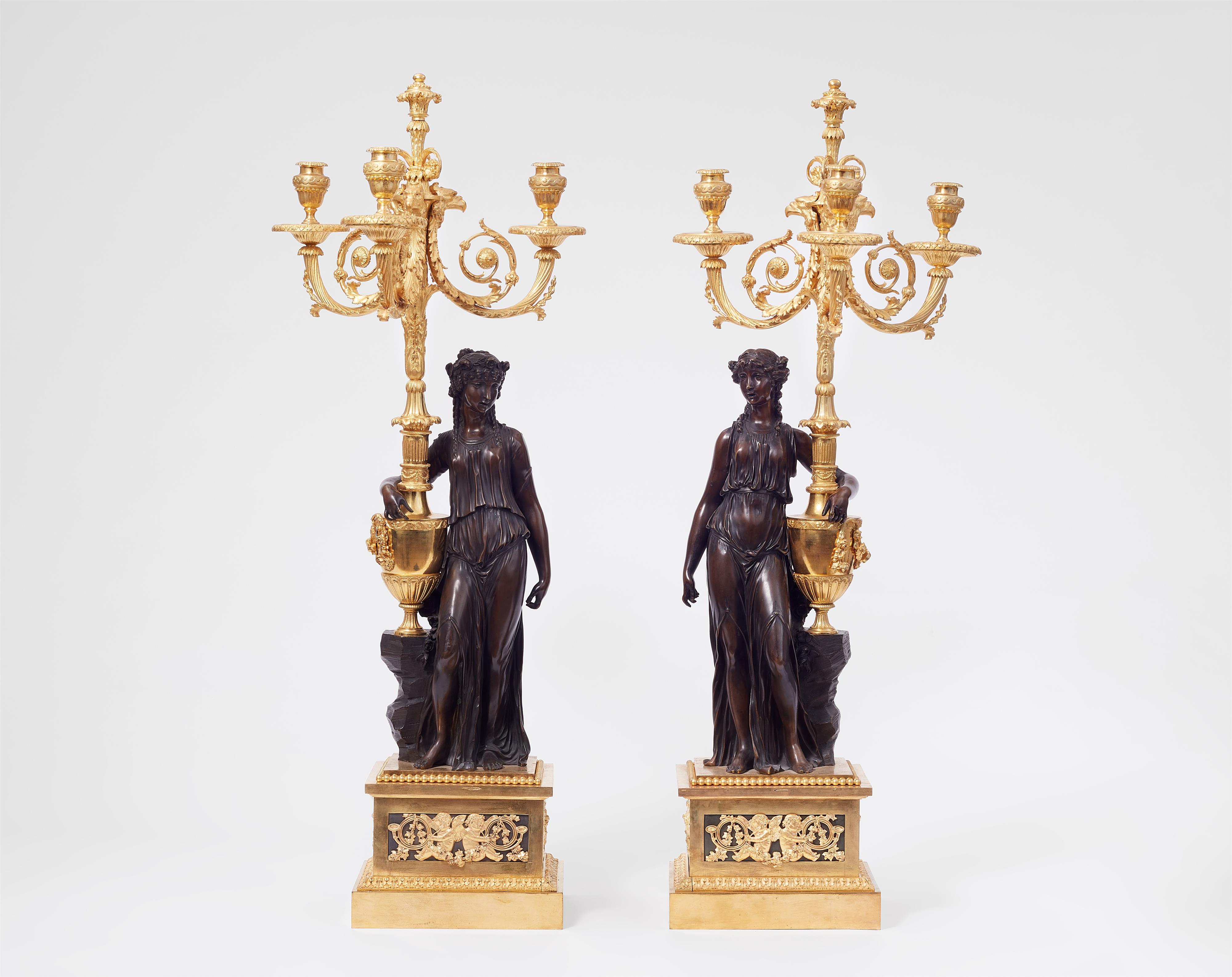 A pair of sculptural ormolu candelabra
after a model by Clodion - image-1