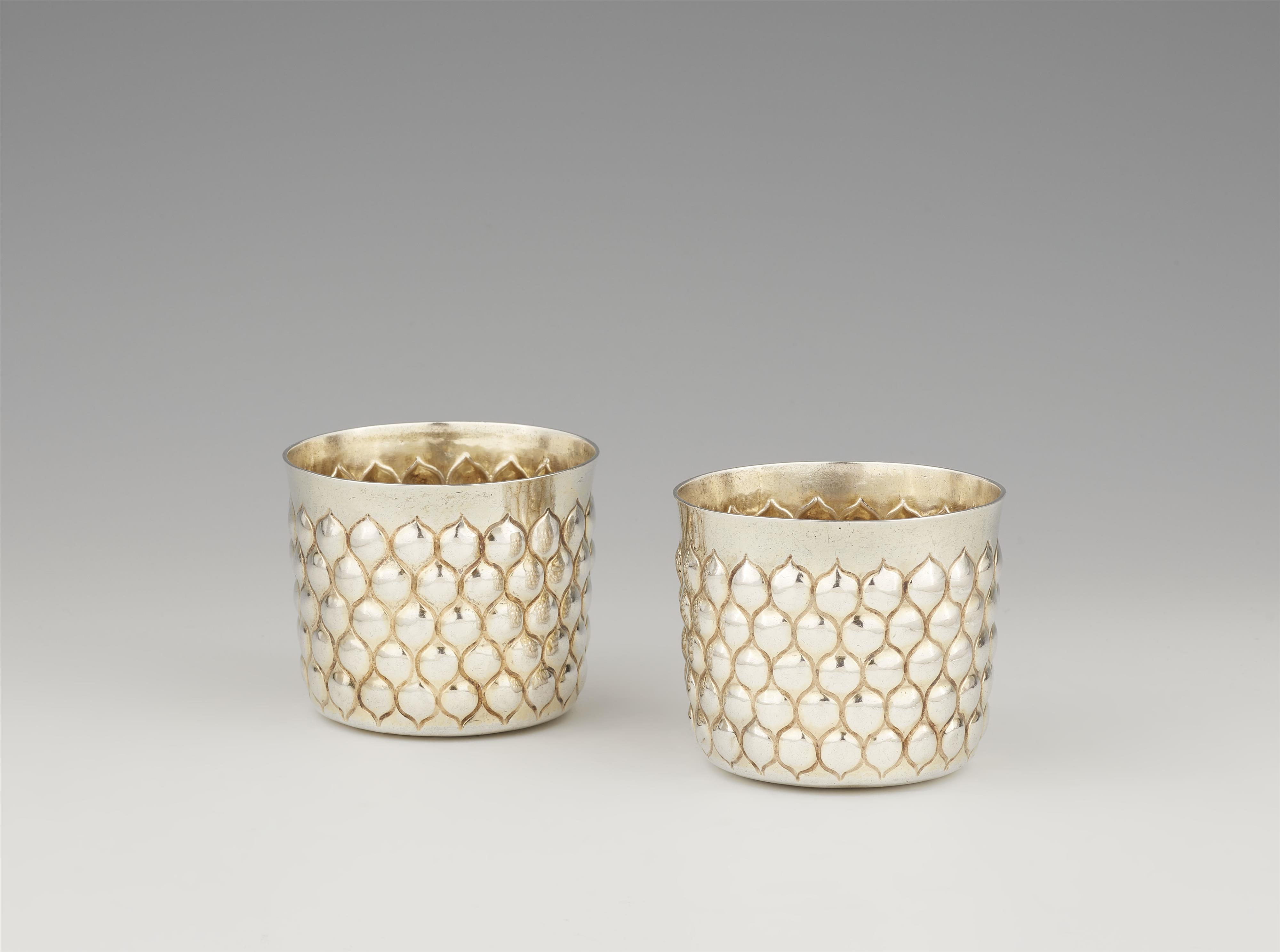 A pair of Nuremberg silver gilt beakers - image-1