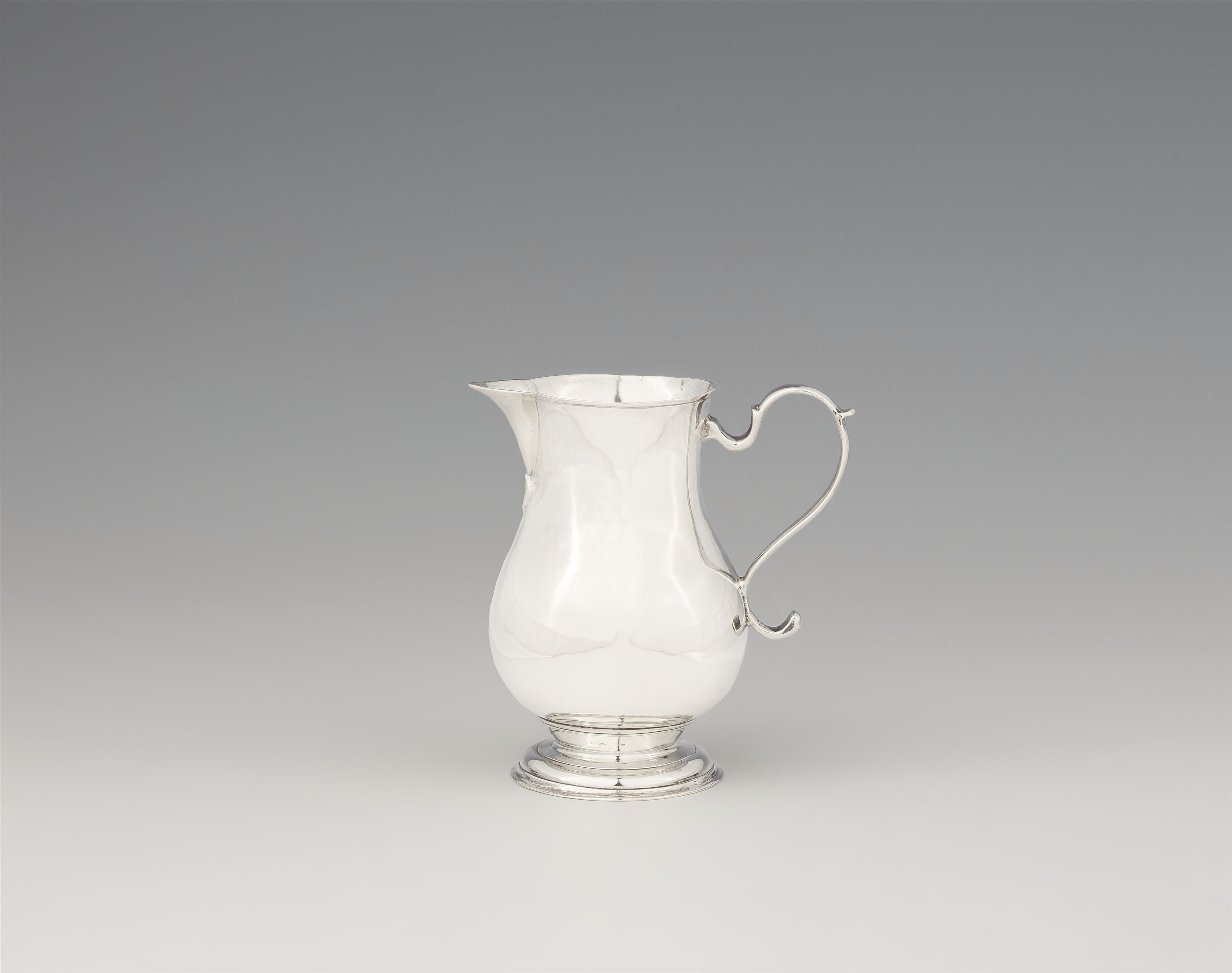 A George II silver cream jug - image-1