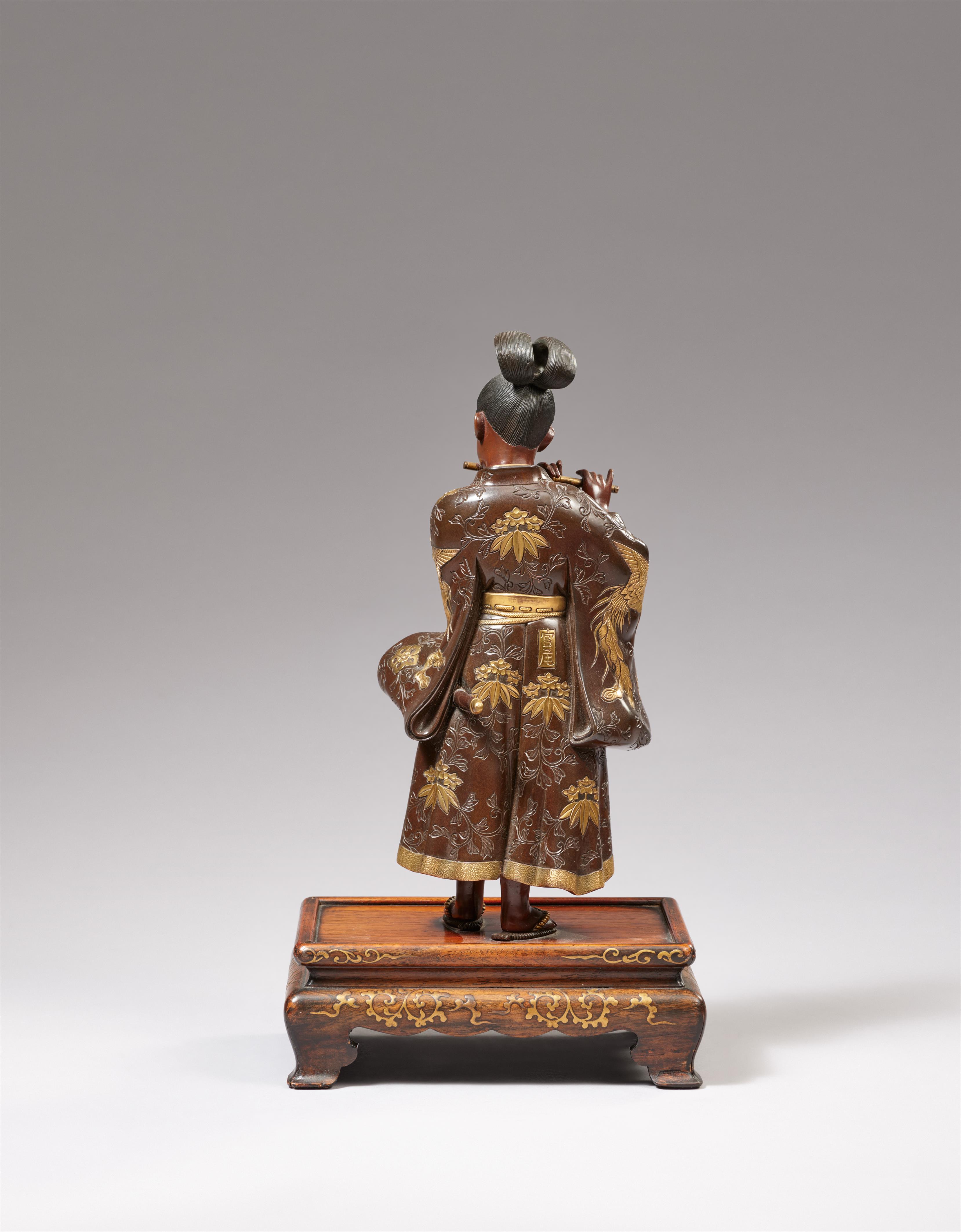 A Miyao bronze figure of a young samurai playing the flute. Bronze and gilding. Late 19th century - image-2