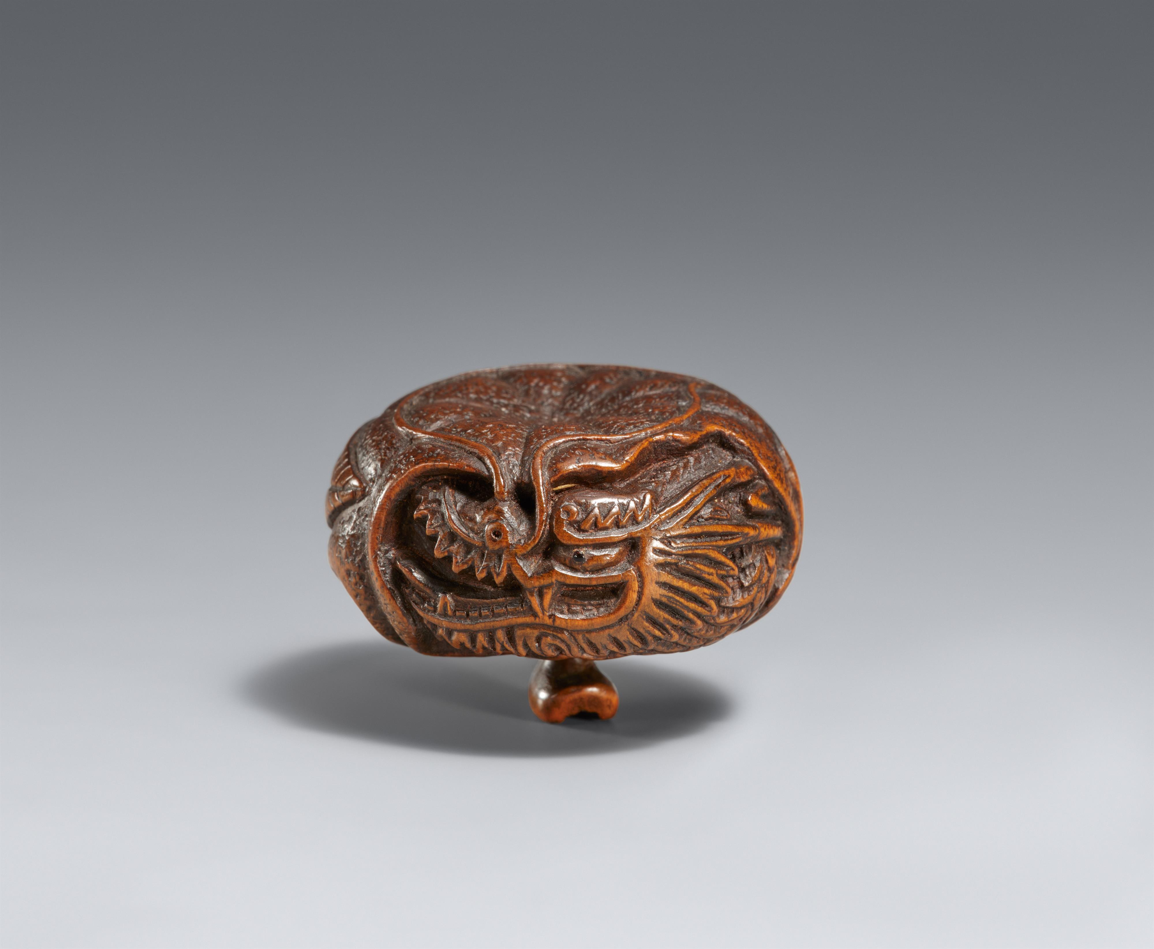 A boxwood netsuke of a dragon inside a mikan. Tanba. Mid-19th century - image-1