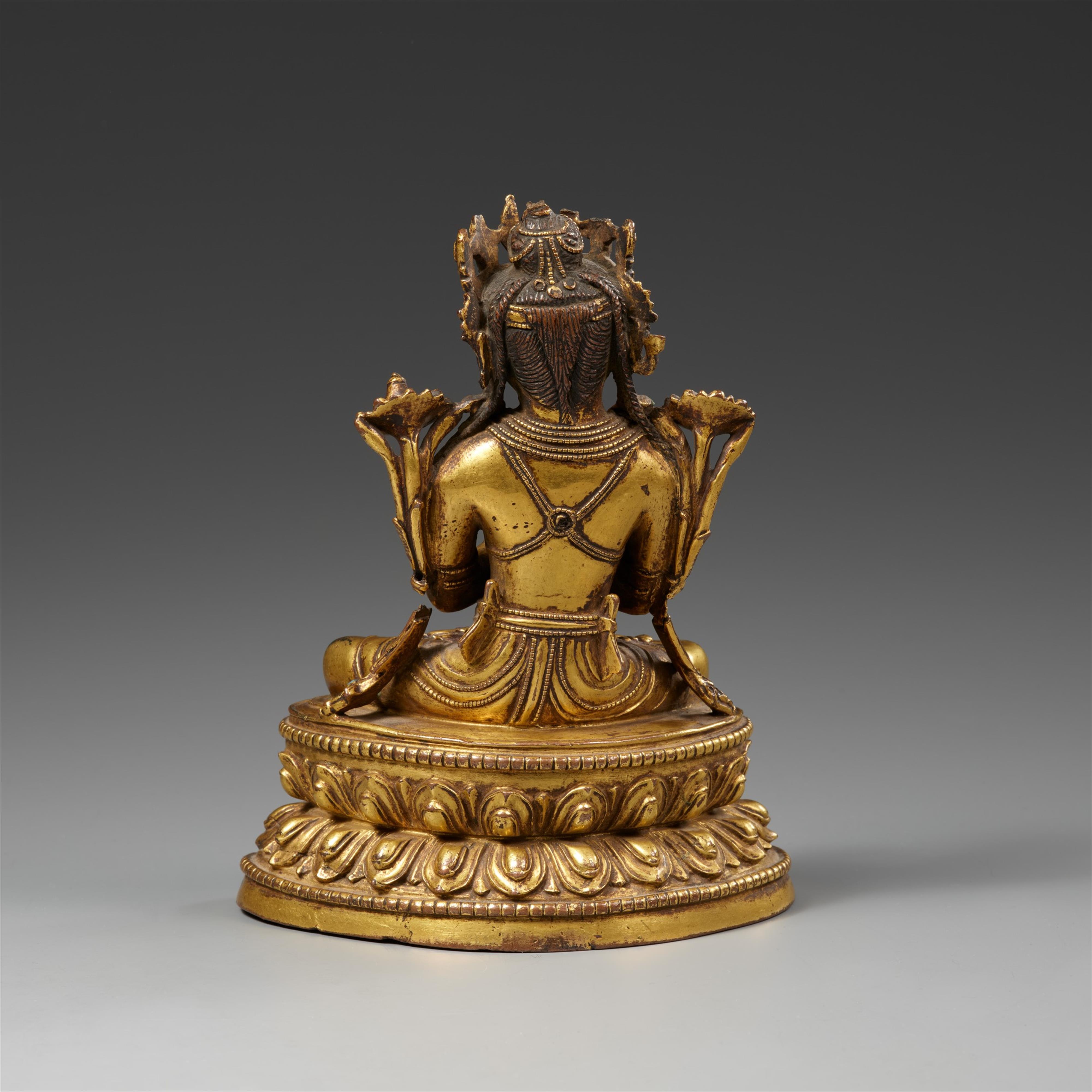 A Tibetan fire-gilt bronze figure of Vajradhara. 15th century - image-2