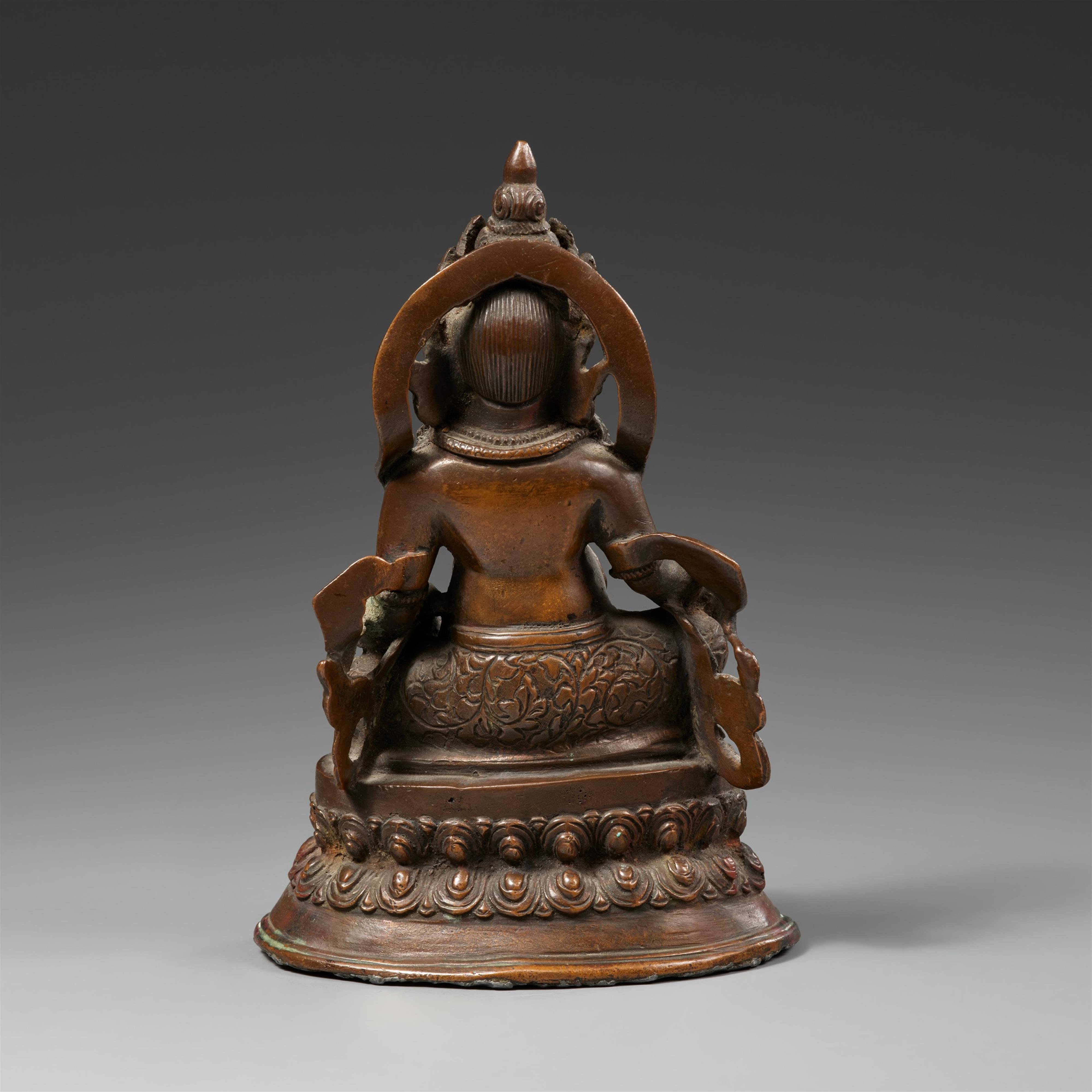 A Tibetan bronze figure of Jambhala. 19th/20th century - image-2