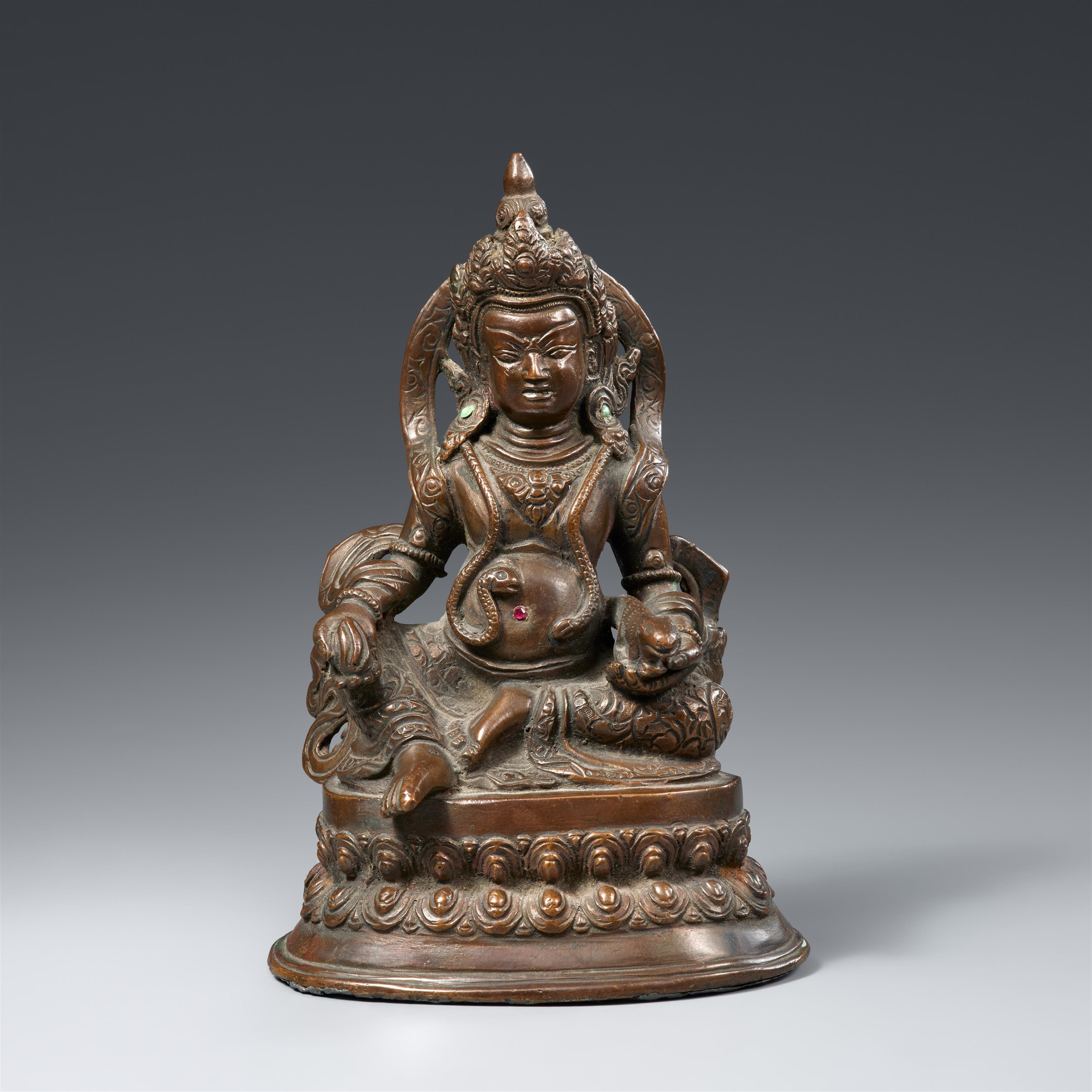 A Tibetan bronze figure of Jambhala. 19th/20th century - image-1