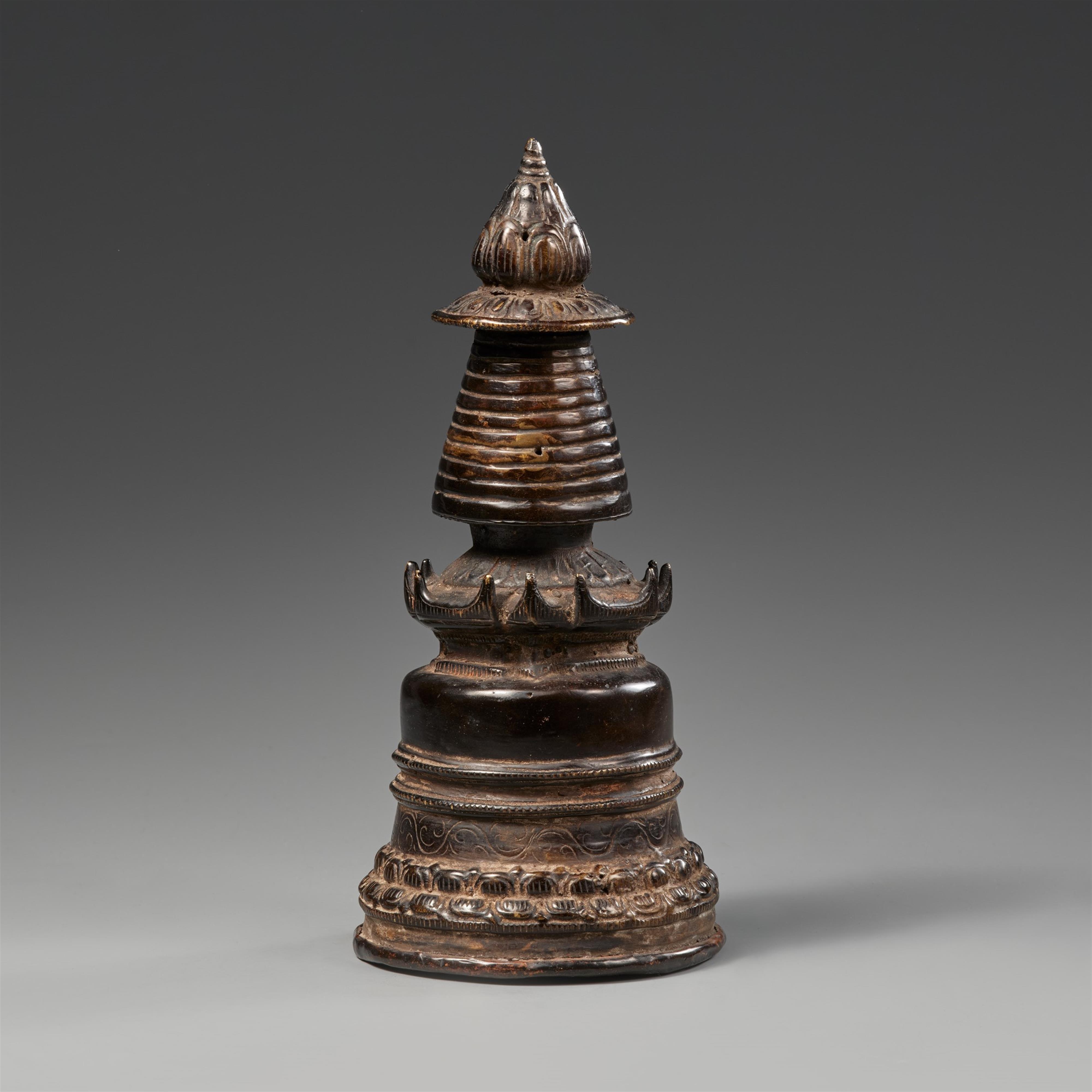 A Tibetan black patinated bronze kadampa-stupa - image-2