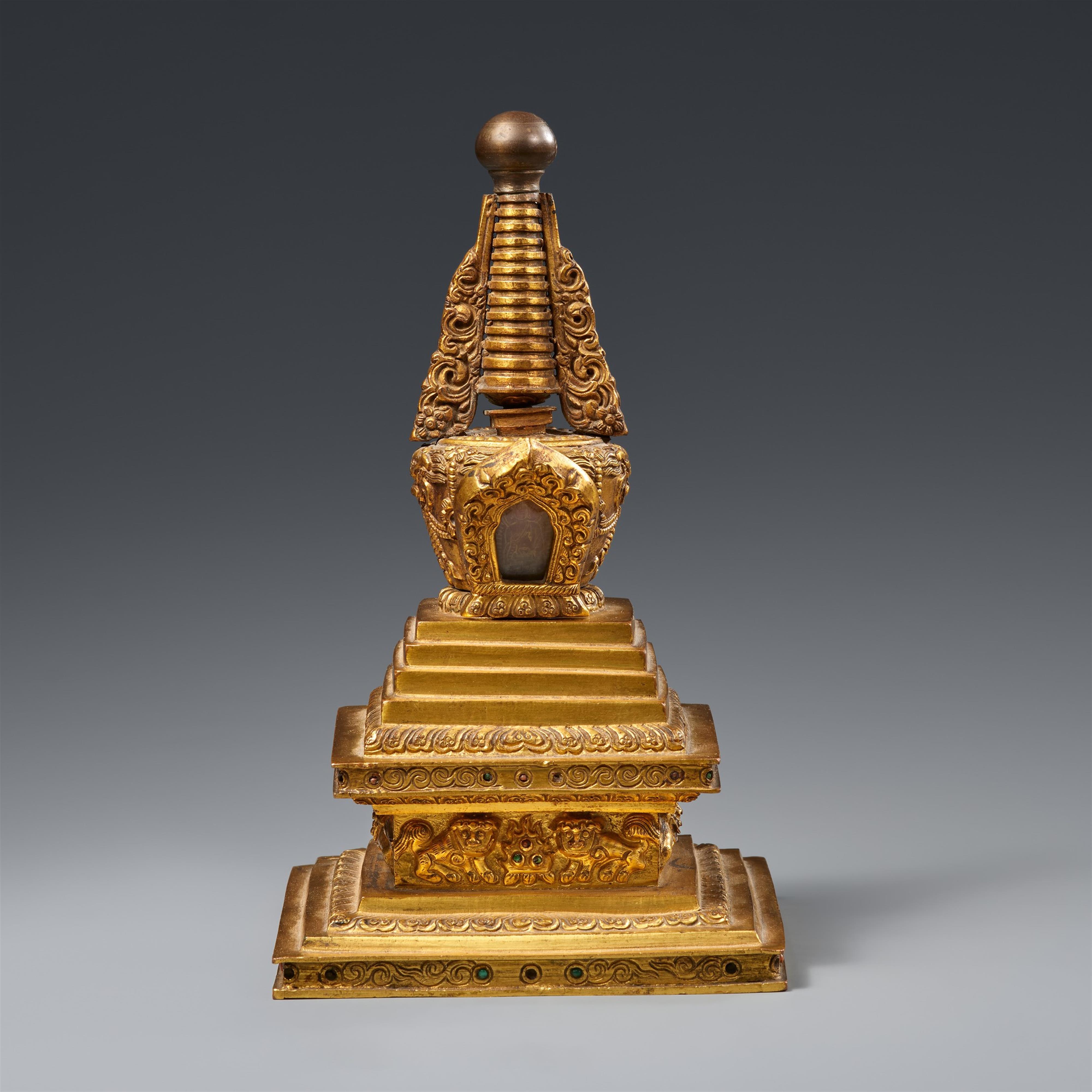 A Tibetan fire-gilt bronze bumpa-stupa. 18th century or later - image-1