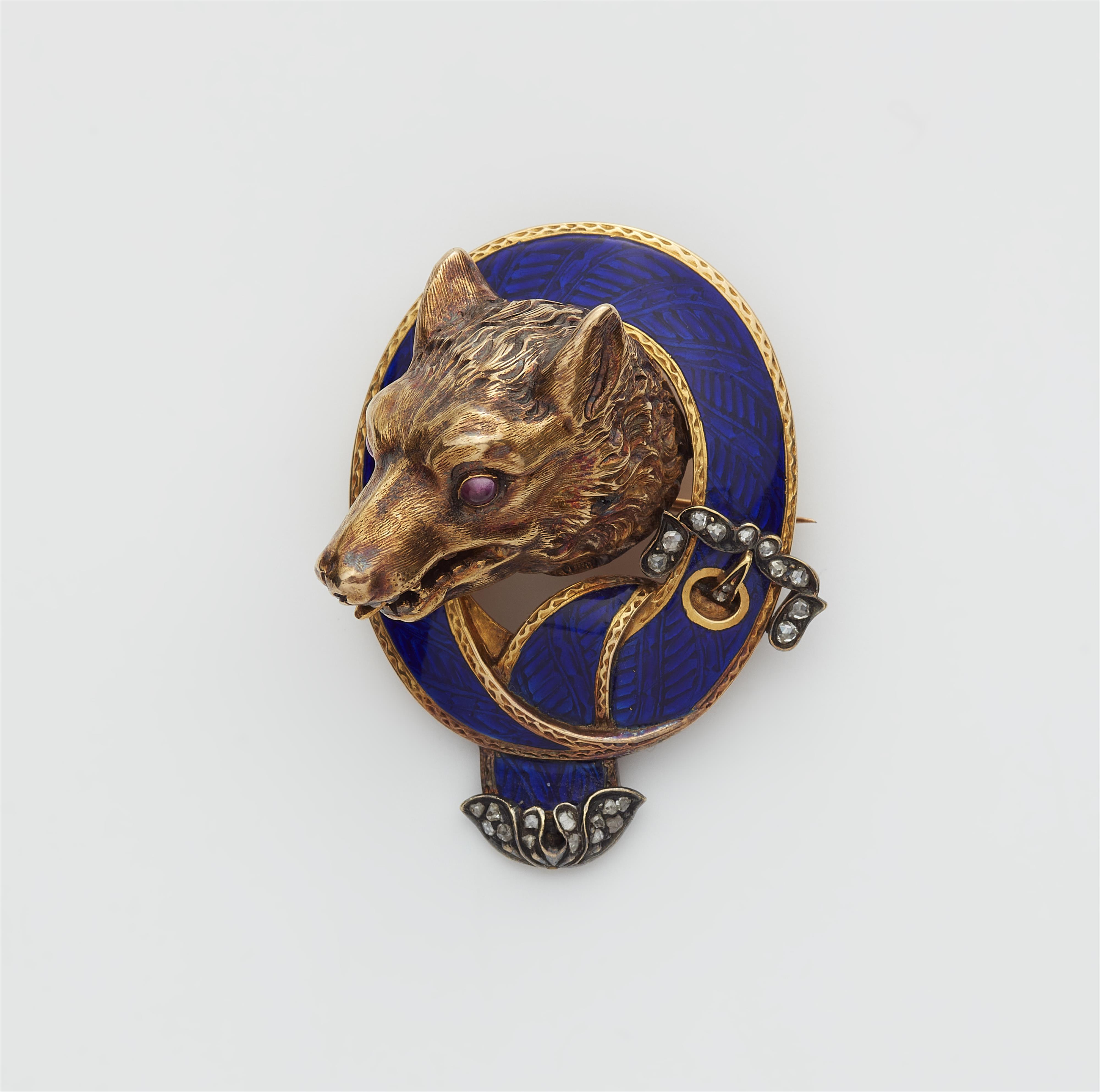 A Victorian 18k gold enamel ruby and diamond hunting brooch with head of a wolf. - image-1