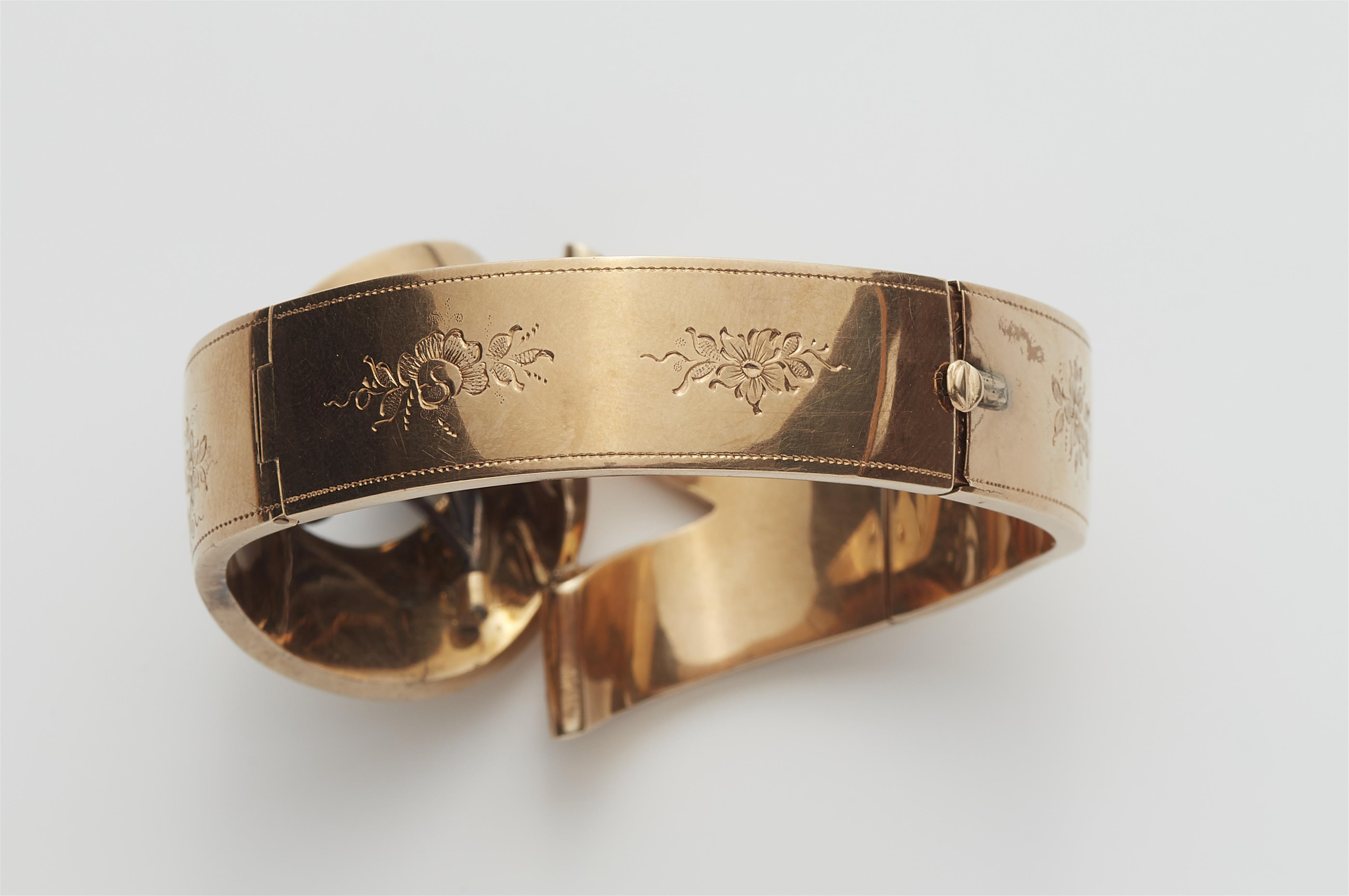 A 14k red gold silver and diamond bangle. - image-3