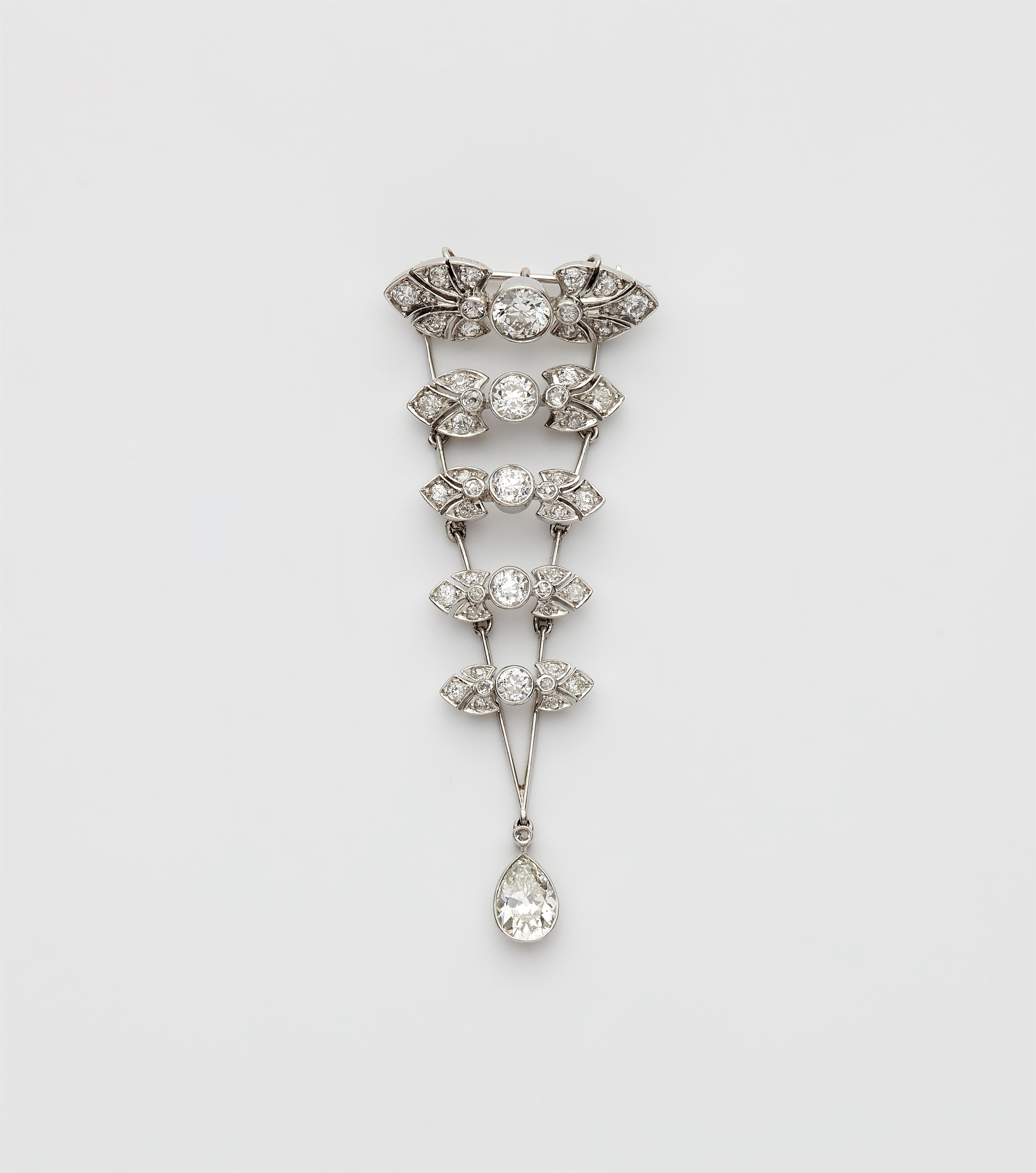 A platinum and diamond pendant brooch. - image-1
