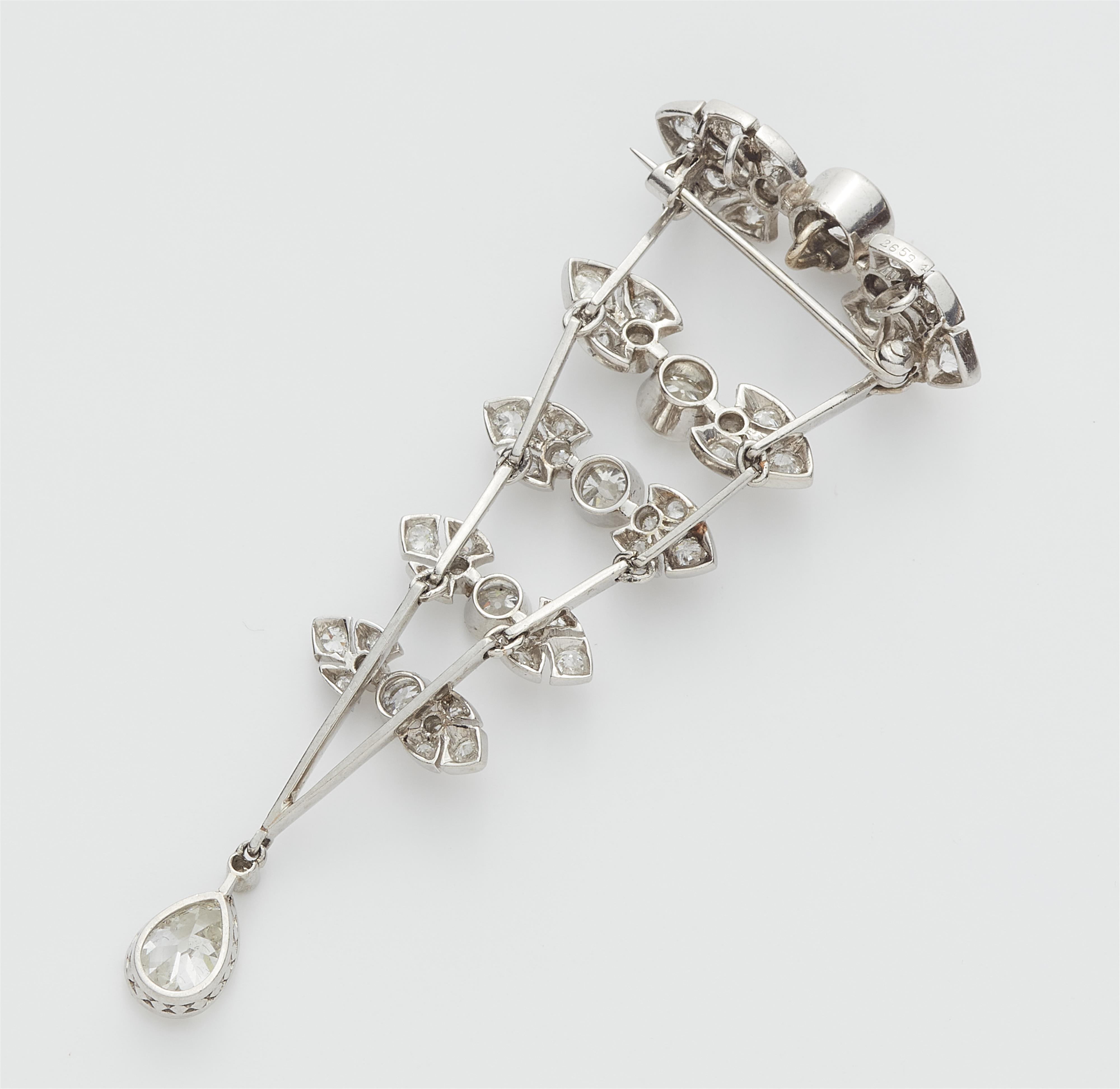 A platinum and diamond pendant brooch. - image-2