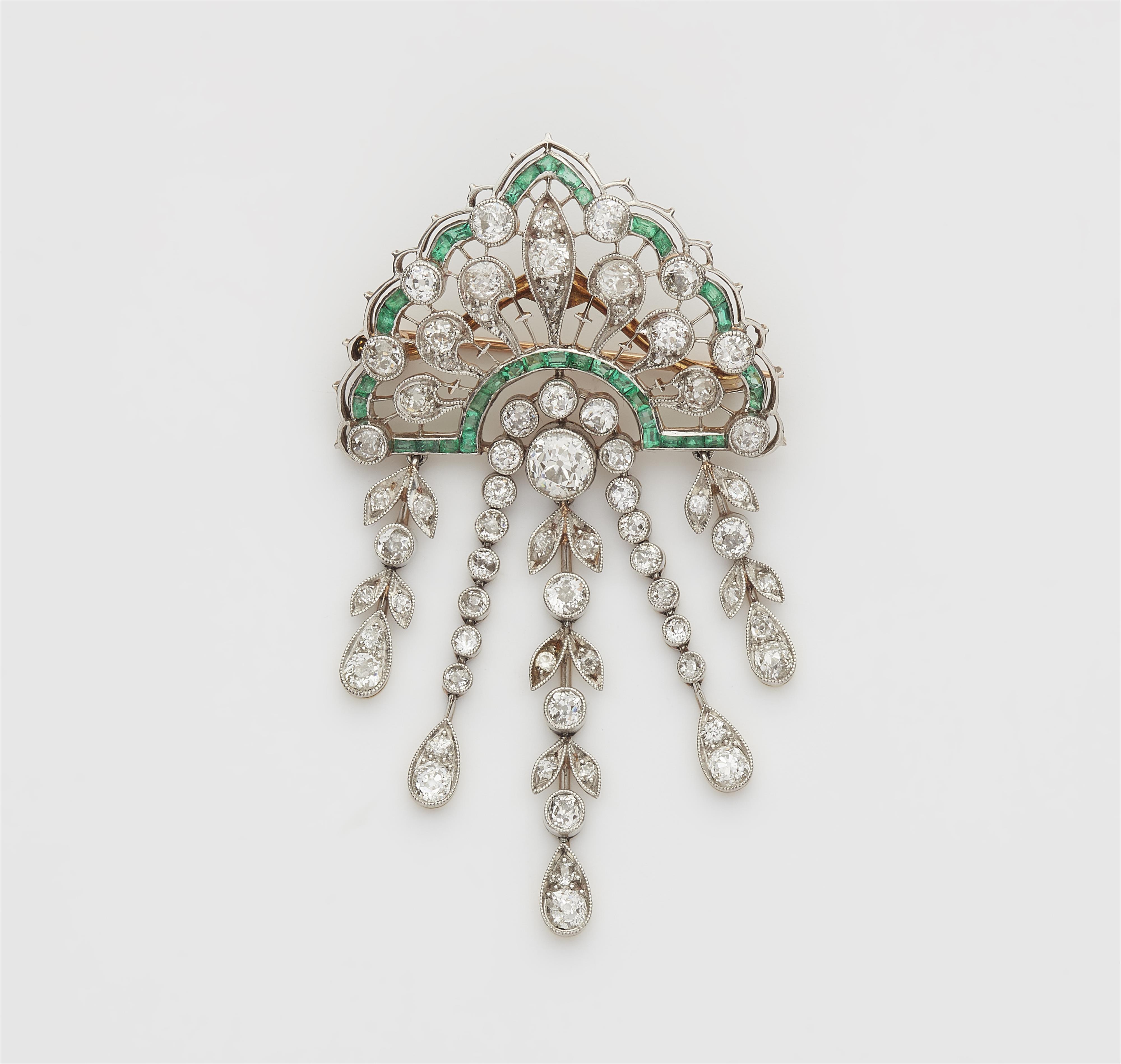 An Edwardian platinum 14k gold diamond and emerald waterfall brooch. - image-1