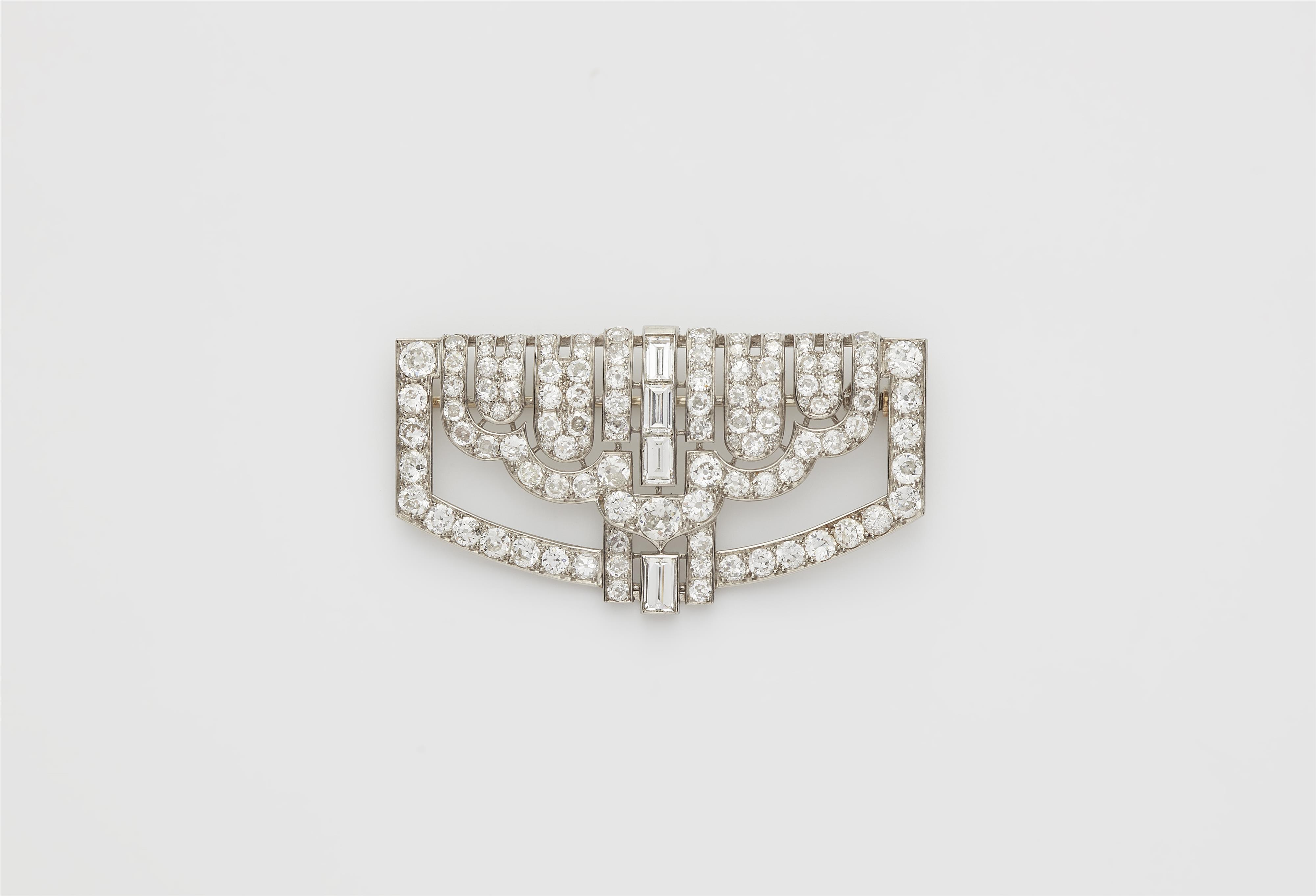 A French Art Déco platinum 18k white gold and diamond brooch. - image-1