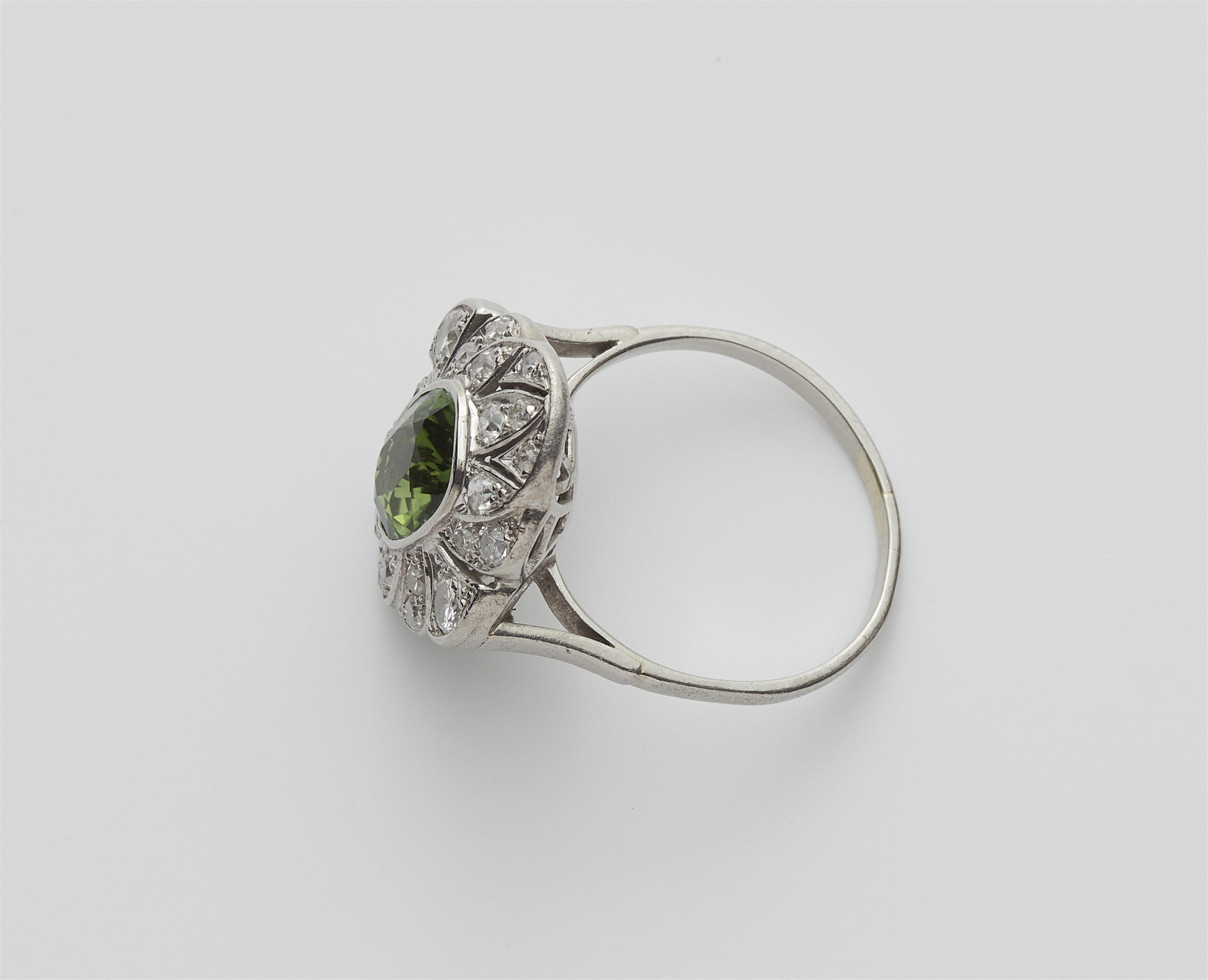 An 18k white gold diamond and green tourmaline Art Déco ring. - image-3