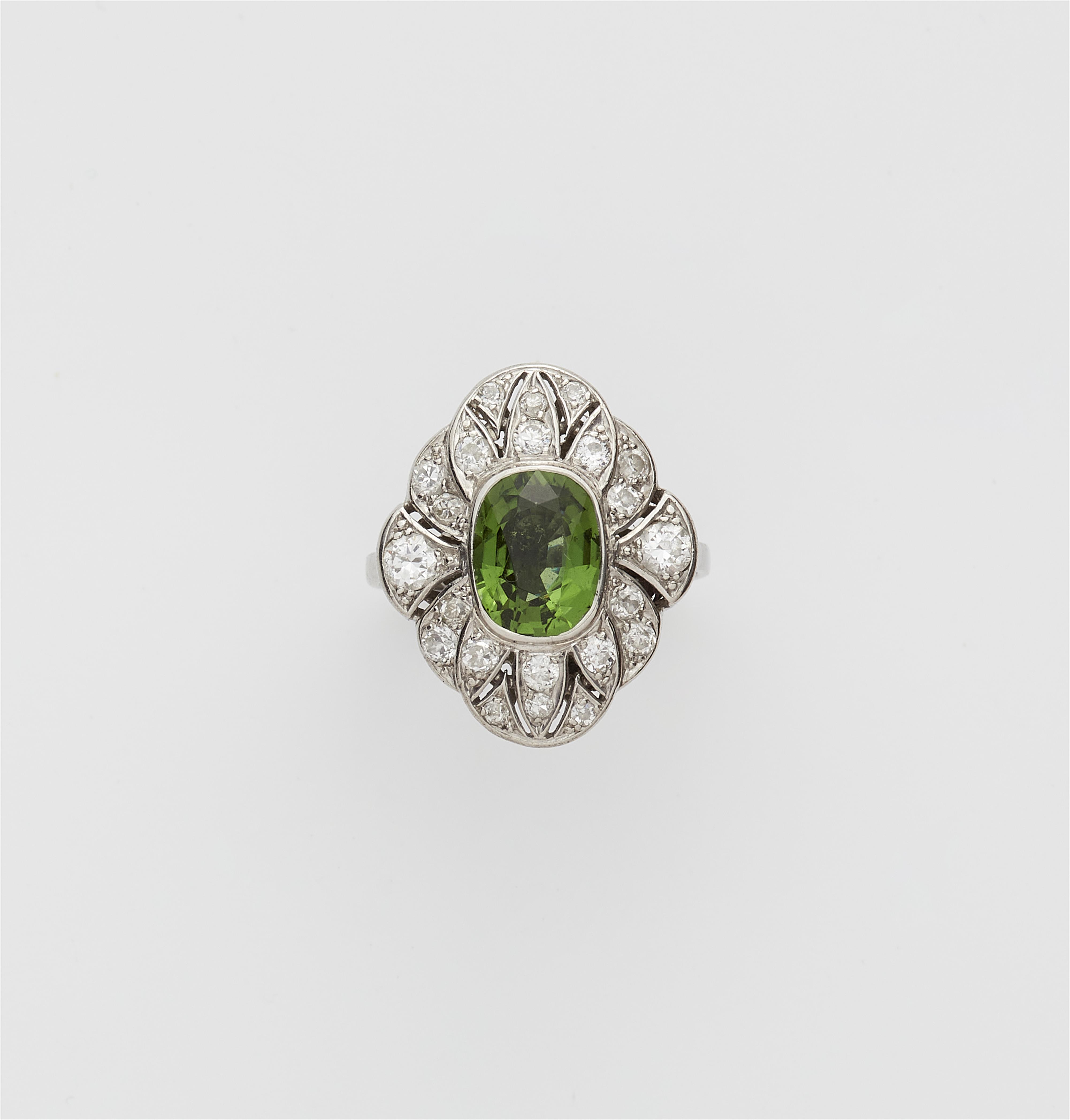 An 18k white gold diamond and green tourmaline Art Déco ring. - image-1