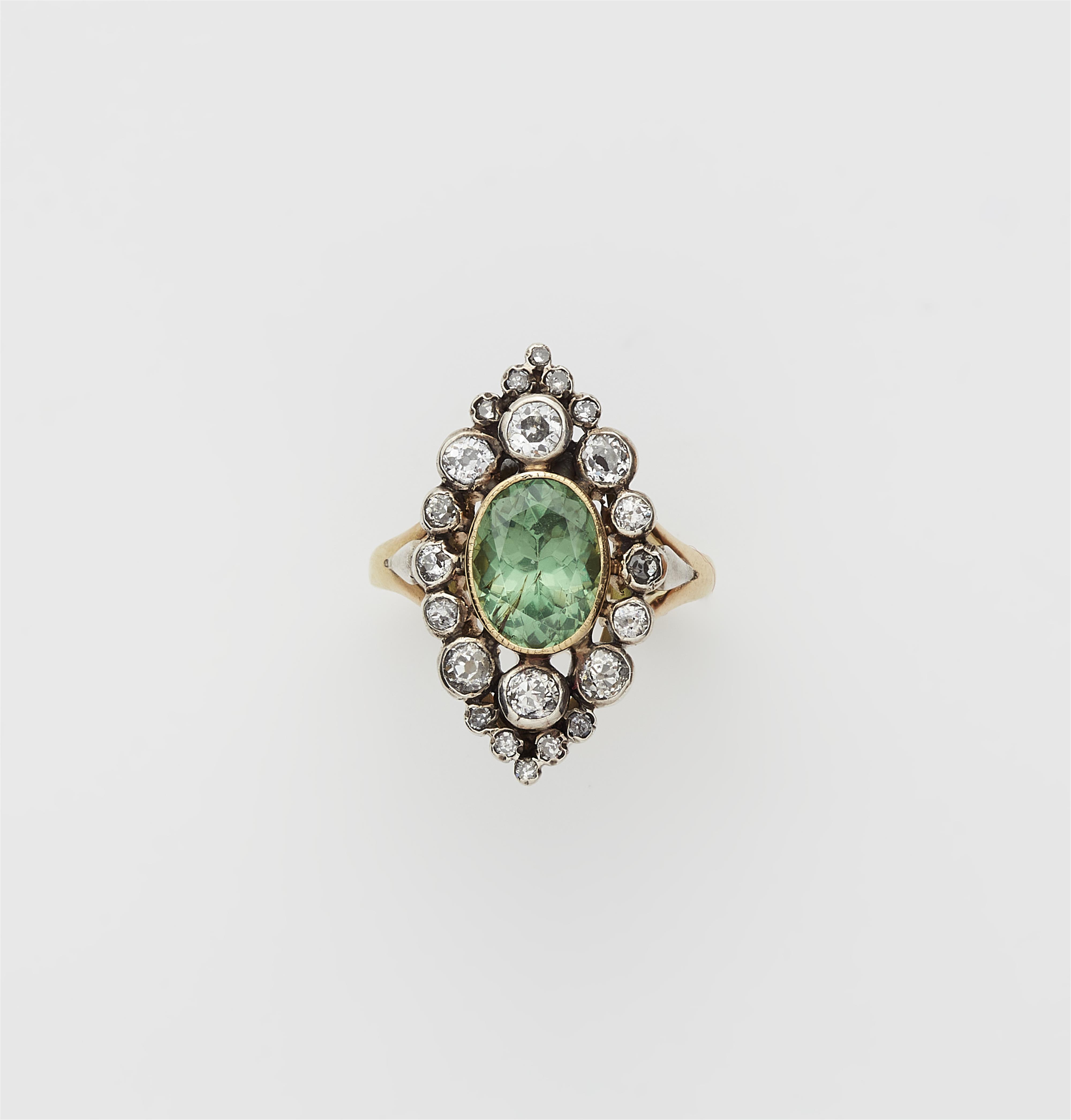 A French Belle Époque 18k yellow gold and silver demantoid marquise ring. - image-1