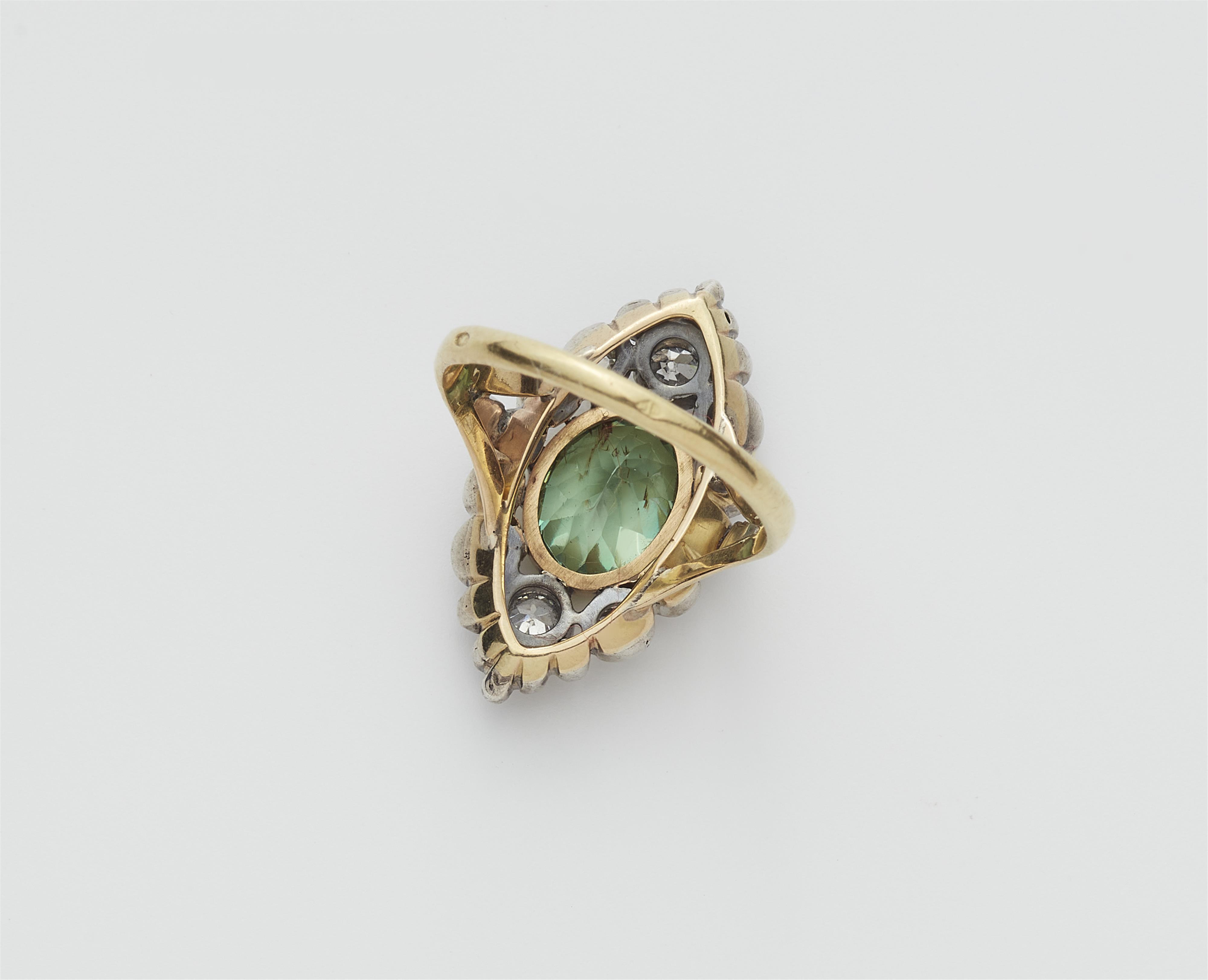 A French Belle Époque 18k yellow gold and silver demantoid marquise ring. - image-2