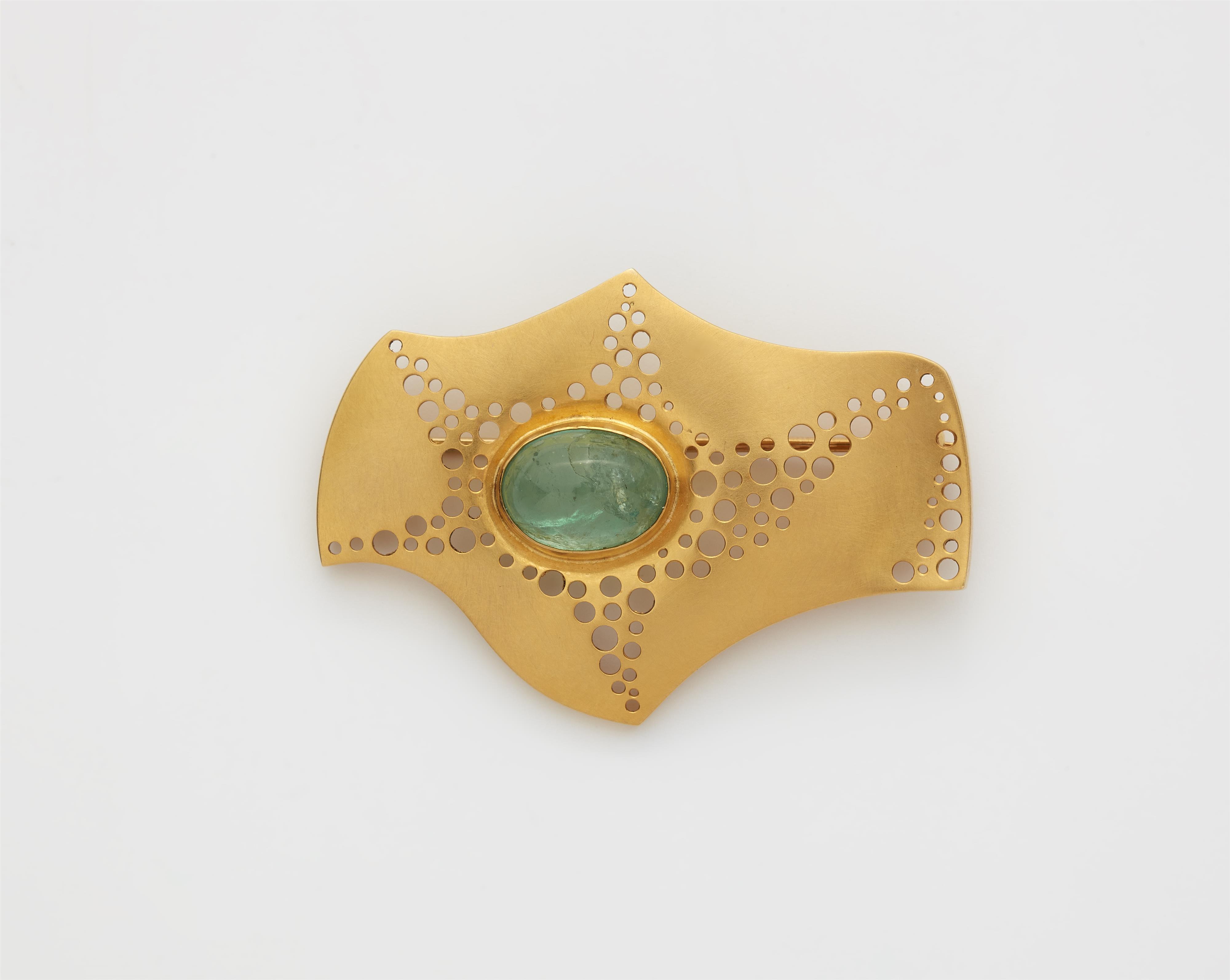 A German 14k yellow gold emerald brooch. - image-1