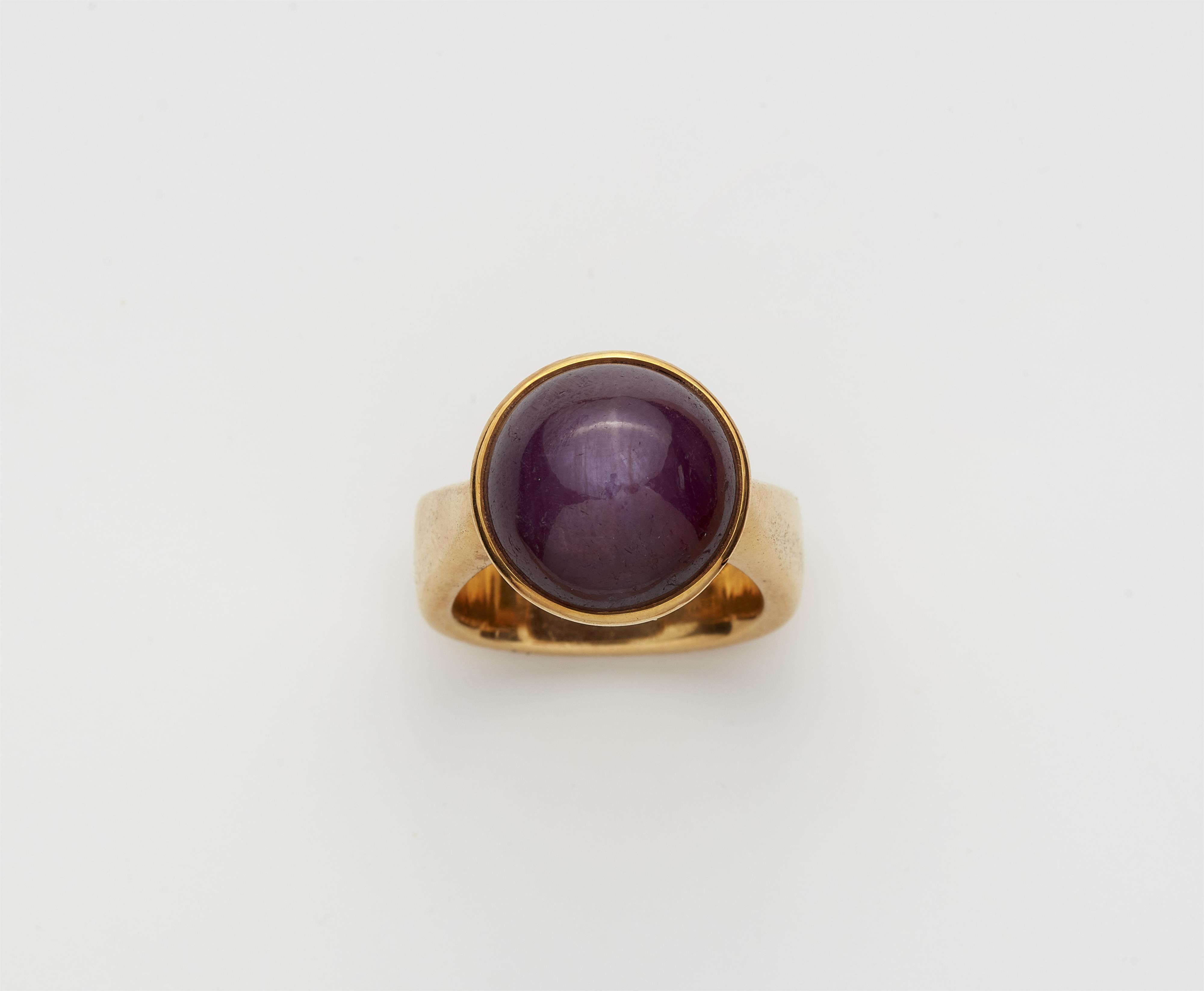 A German 18k gold and star ruby cabochon ring. - image-1