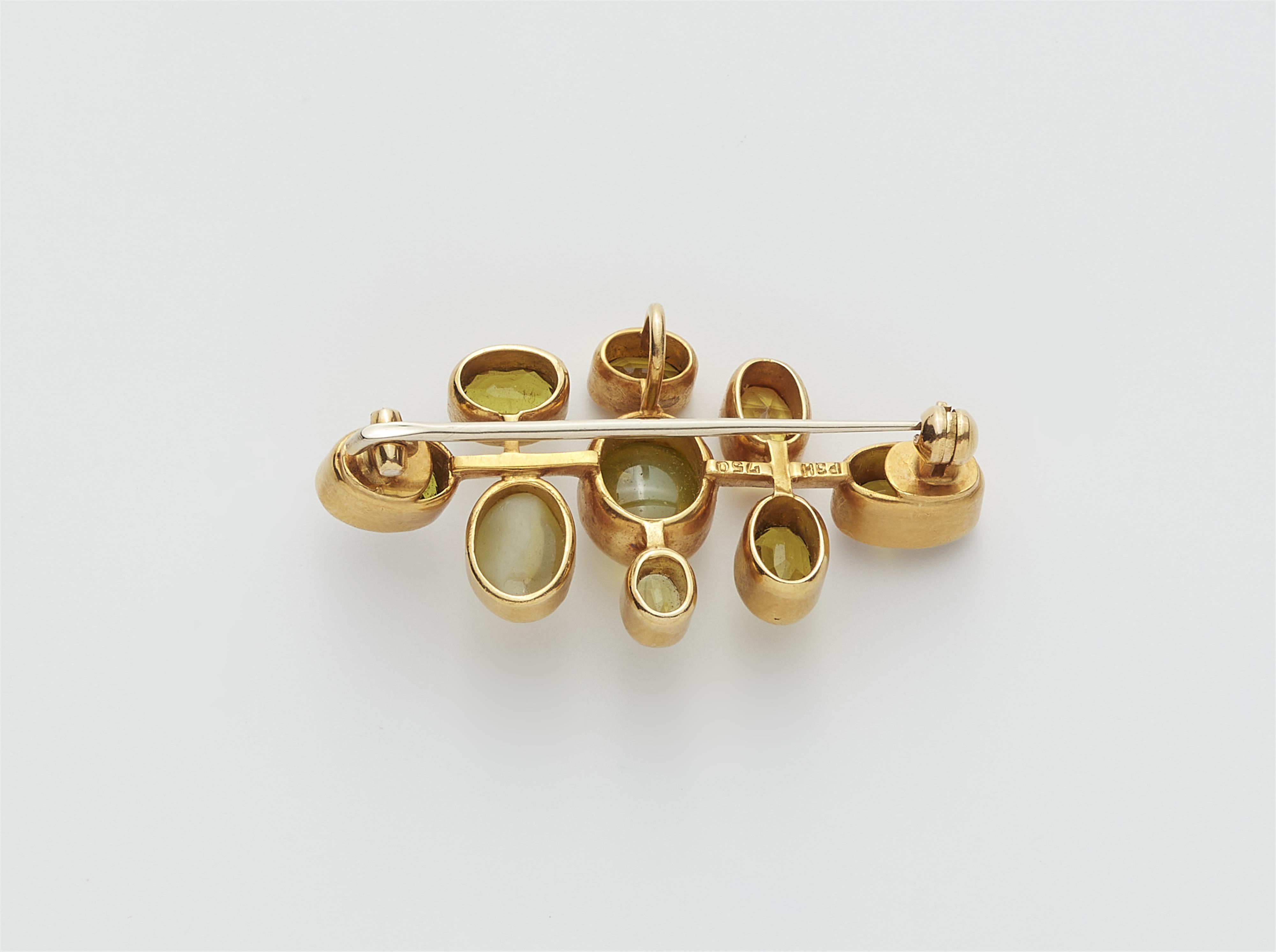 A German 18k gold chrysoberyl and sapphire brooch. - image-2