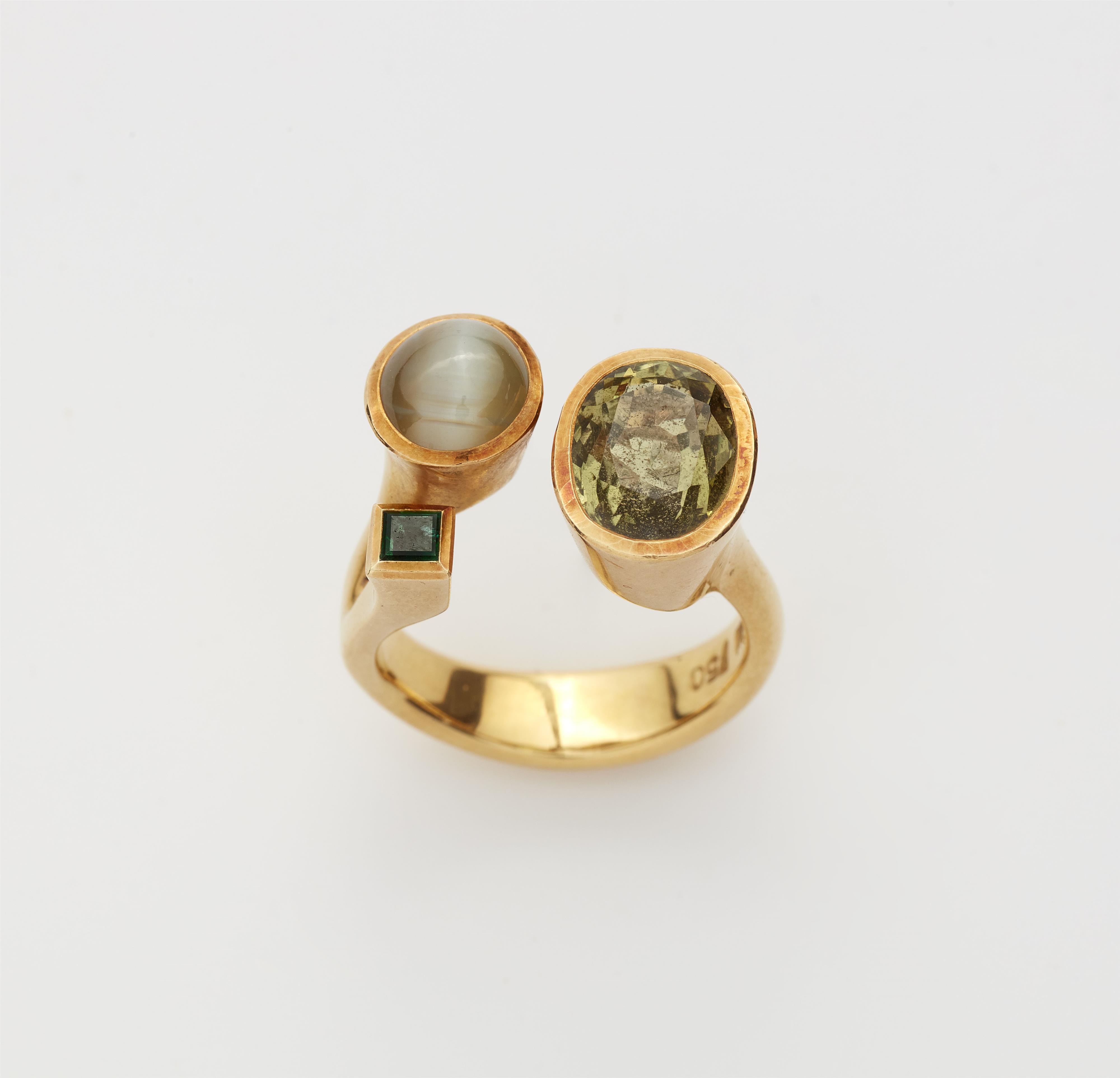 A custom made German chrysoberyl and emerald ring. - image-2