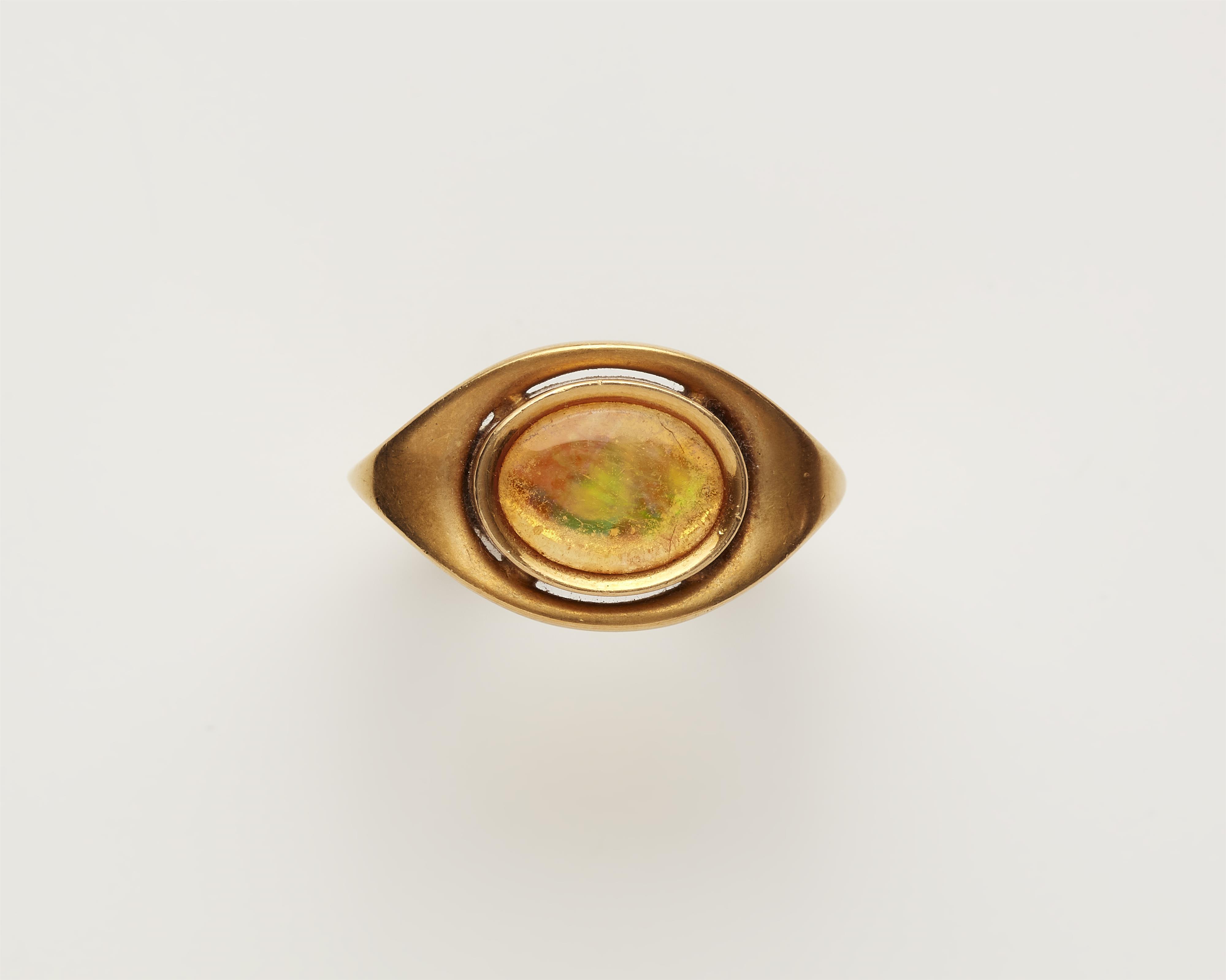 A custom made German 18k gold and fire opal ring. - image-1
