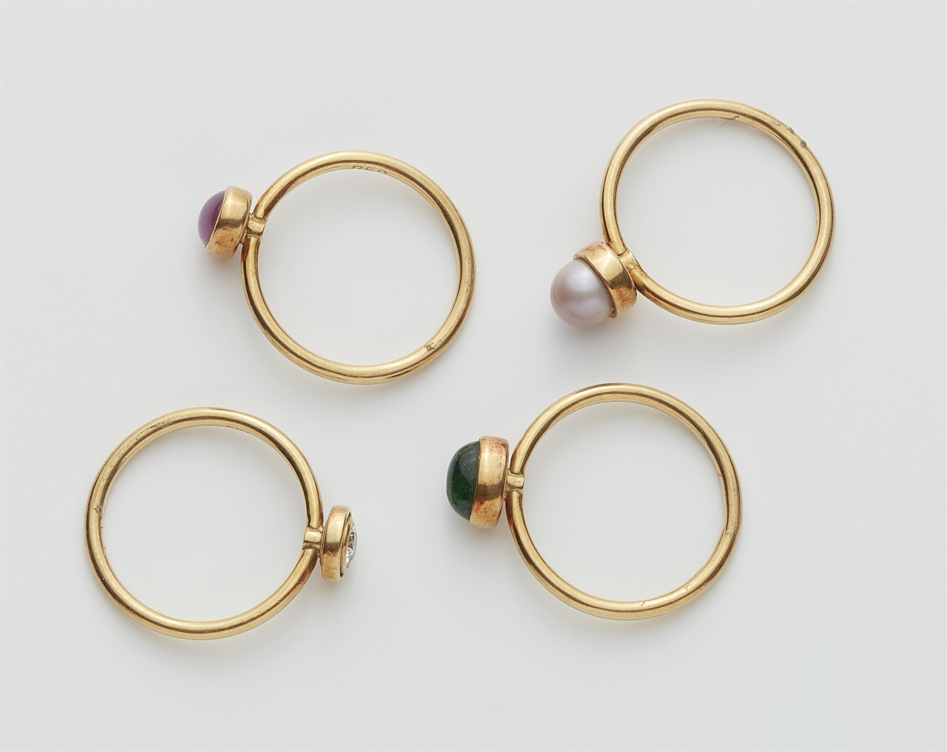 A set of four 18k gold gemstone and natural pearl rings. - image-2