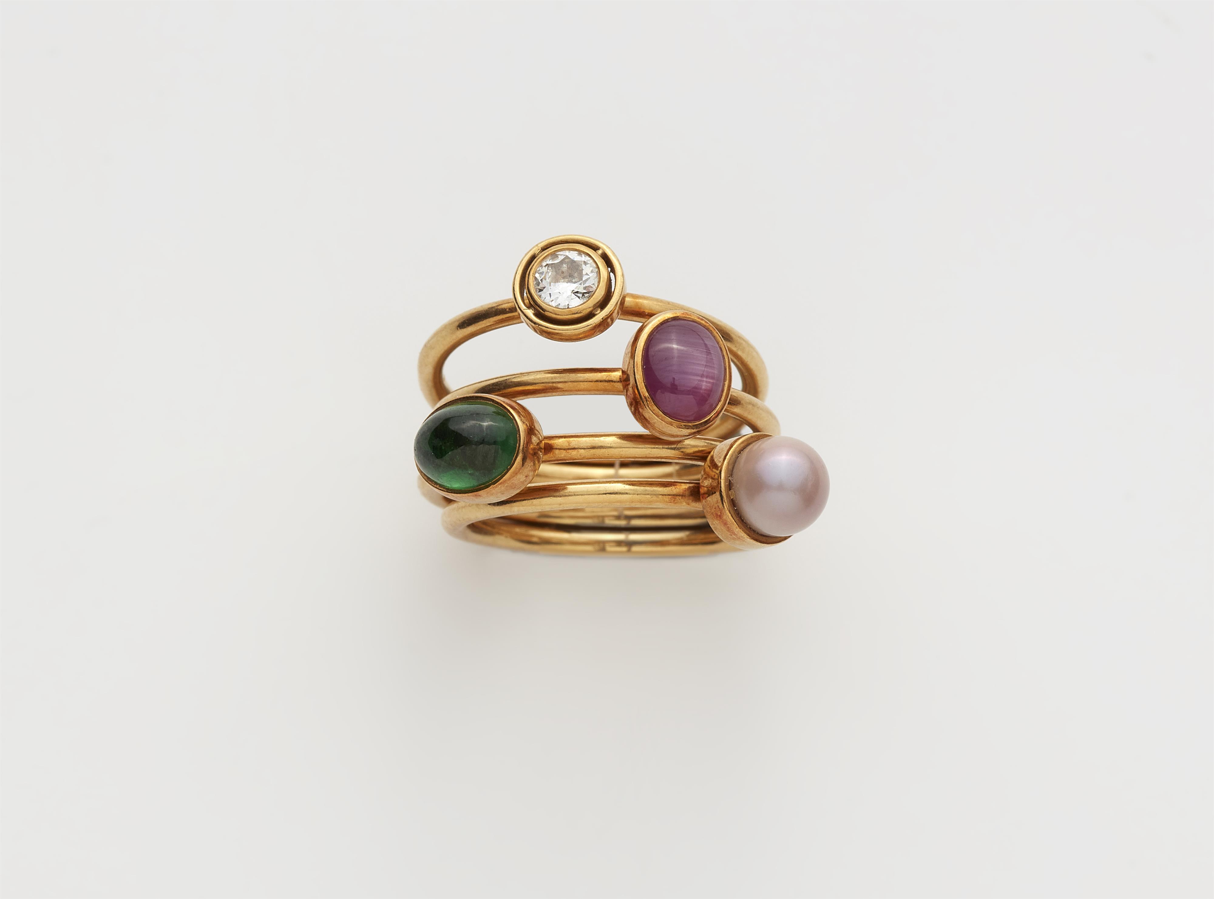 A set of four 18k gold gemstone and natural pearl rings. - image-1