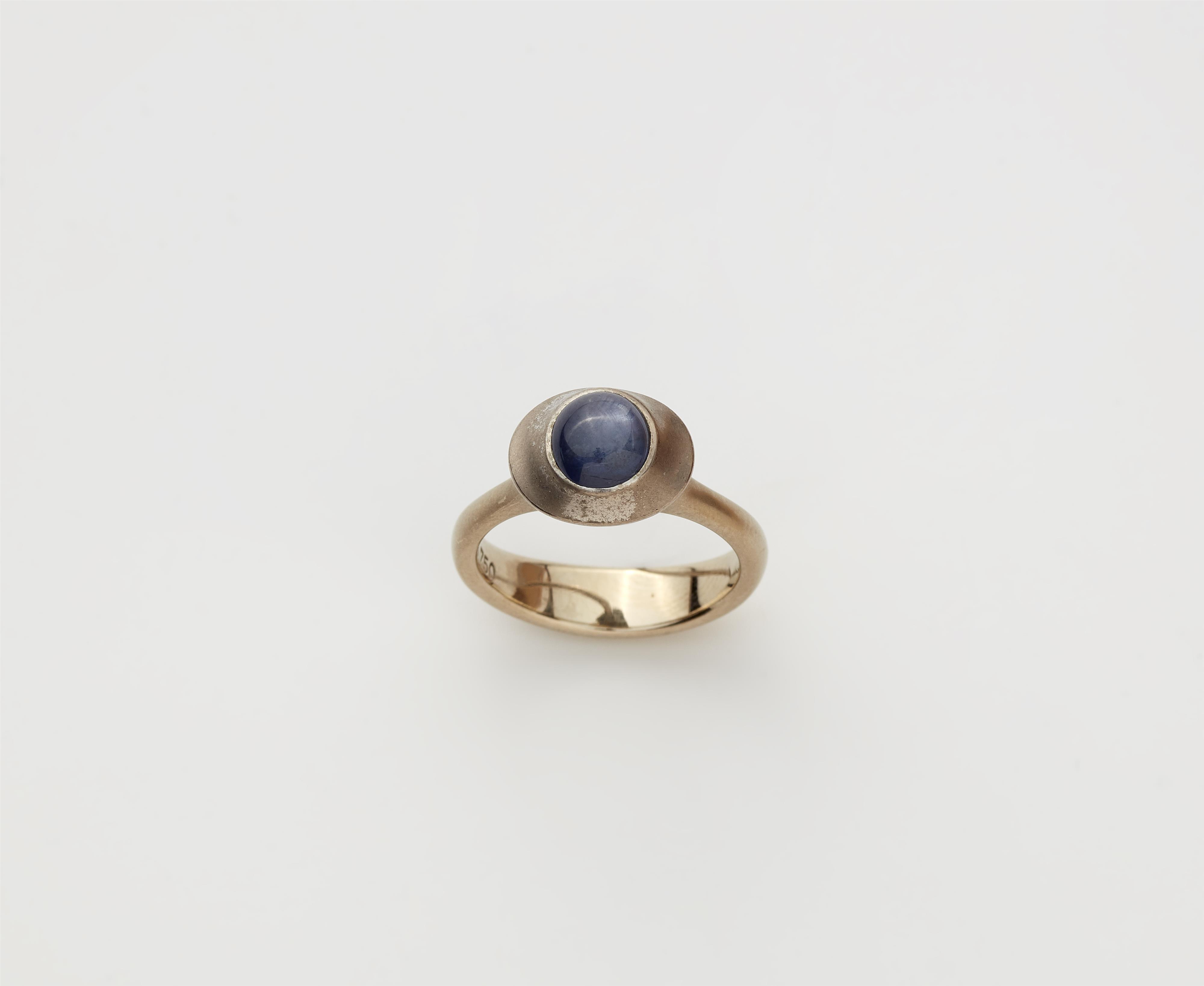 An 18k white gold star sapphire ring. - image-1