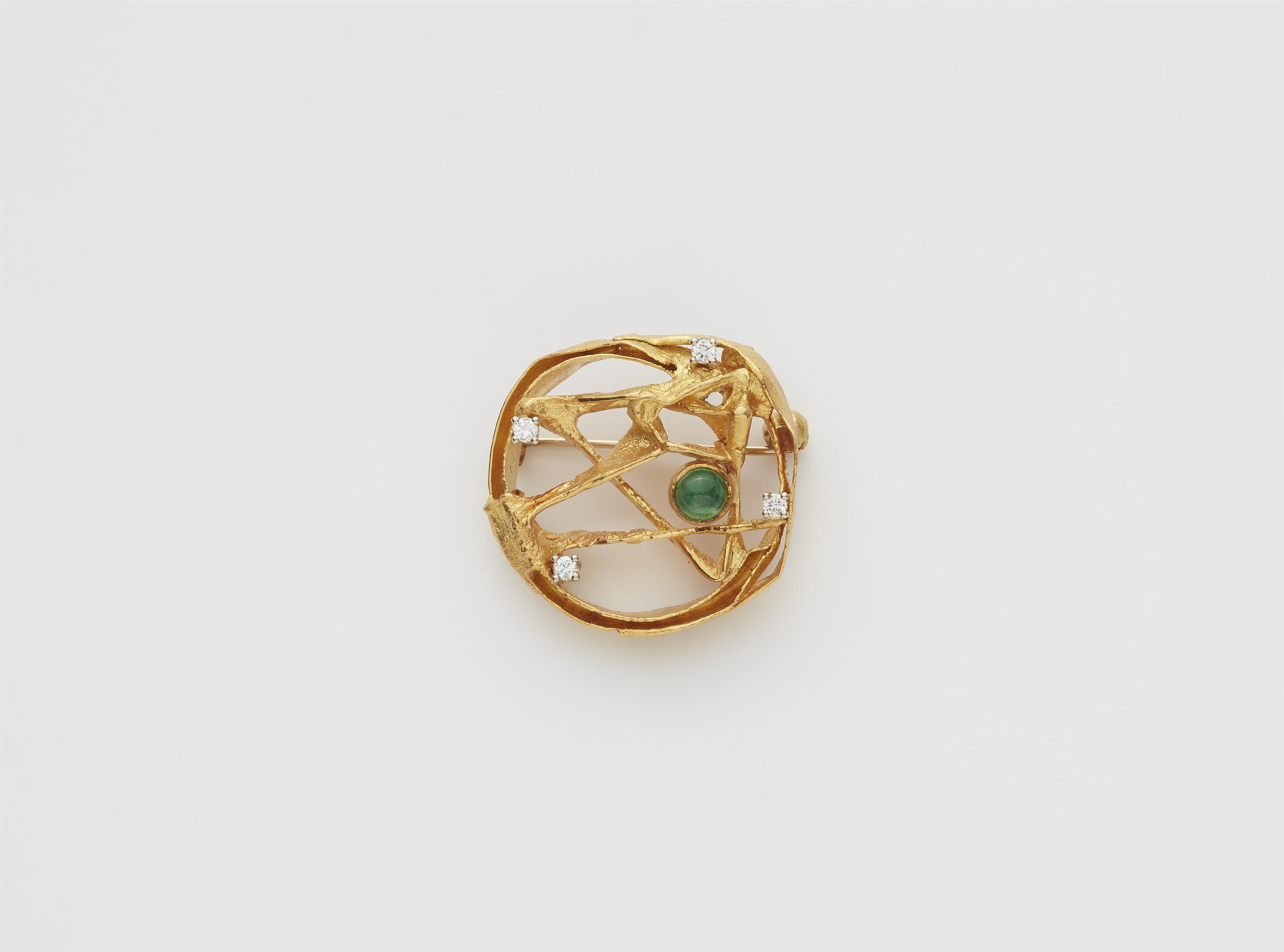A German 20k gold diamond and emerald cabochon brooch. - image-1