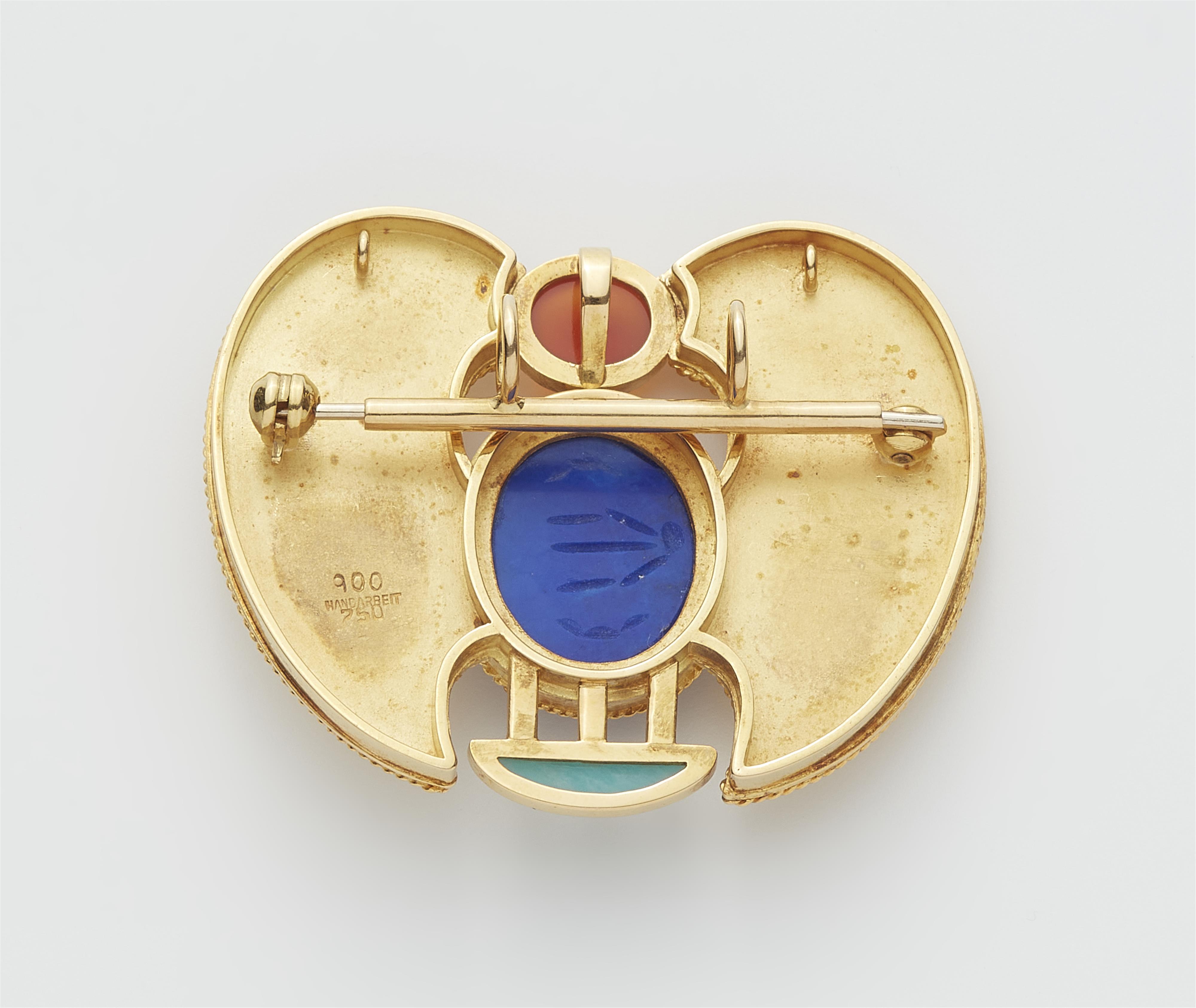 A German one of a kind 18k gold lapis lazuli carnelion and turquoise winged scarab brooch inspired by the famous amulet of Tutankhamun. - image-2