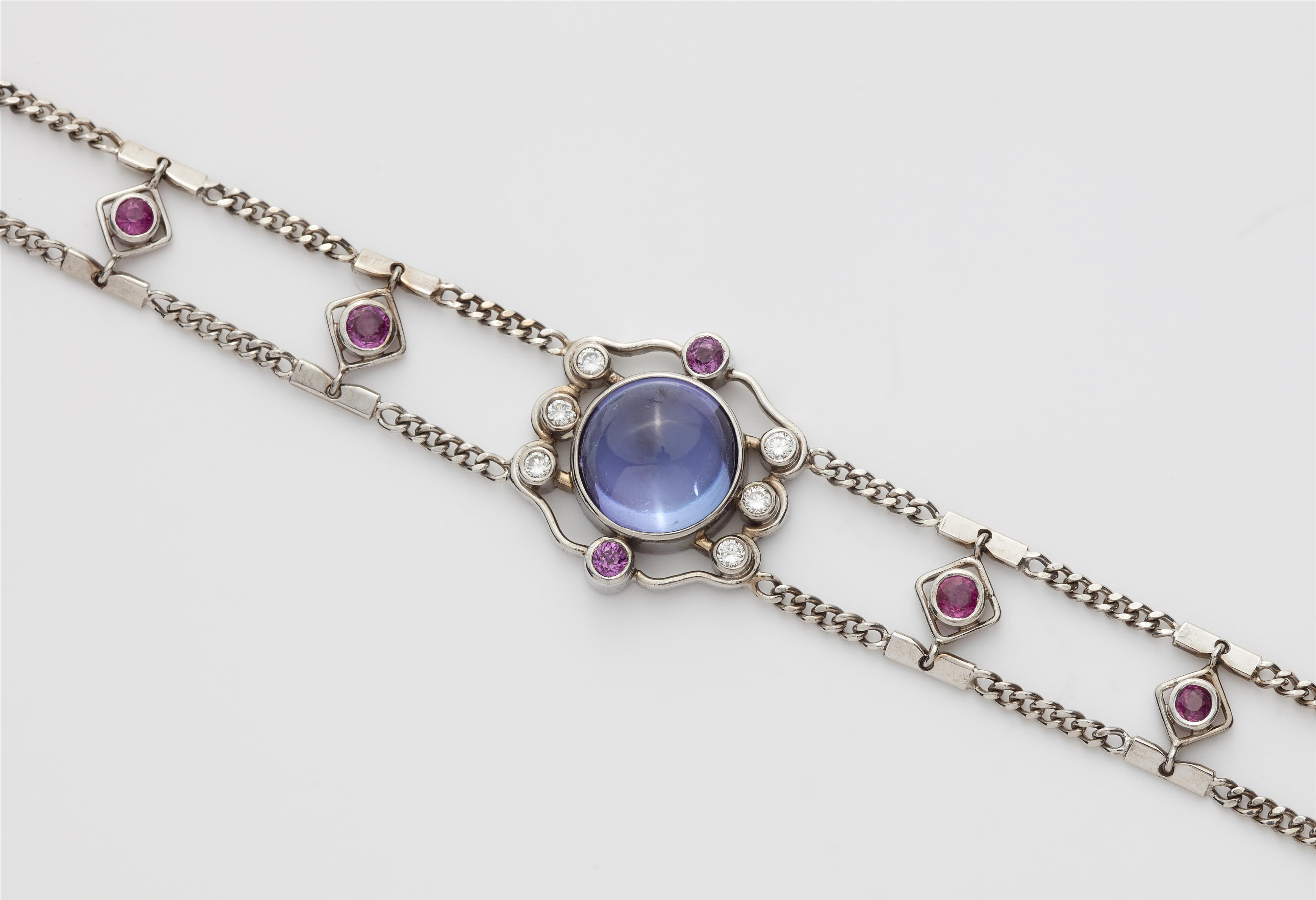 A German 18k white gold tanzanite ruby and diamond bracelet. - image-2