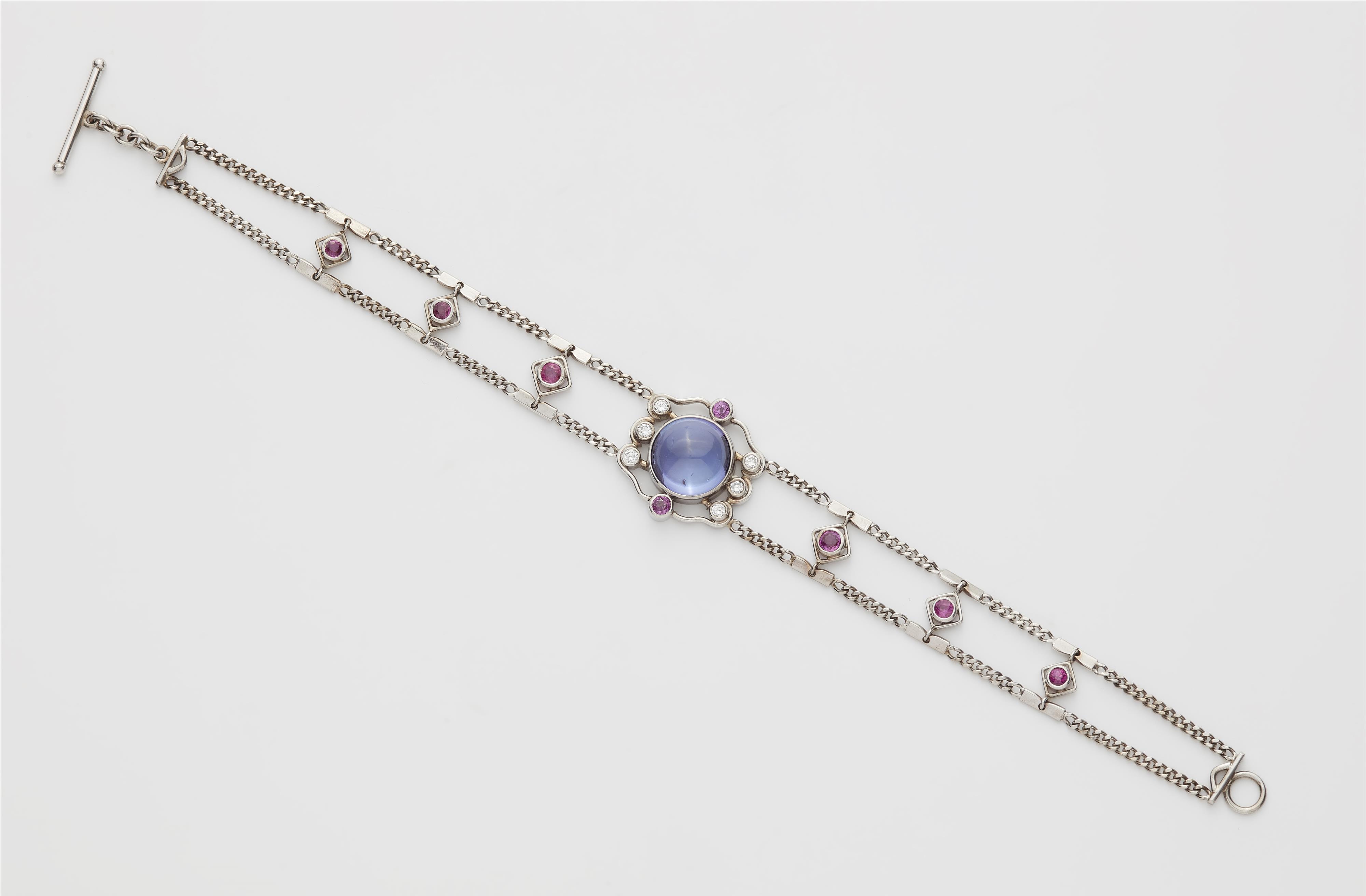 A German 18k white gold tanzanite ruby and diamond bracelet. - image-1