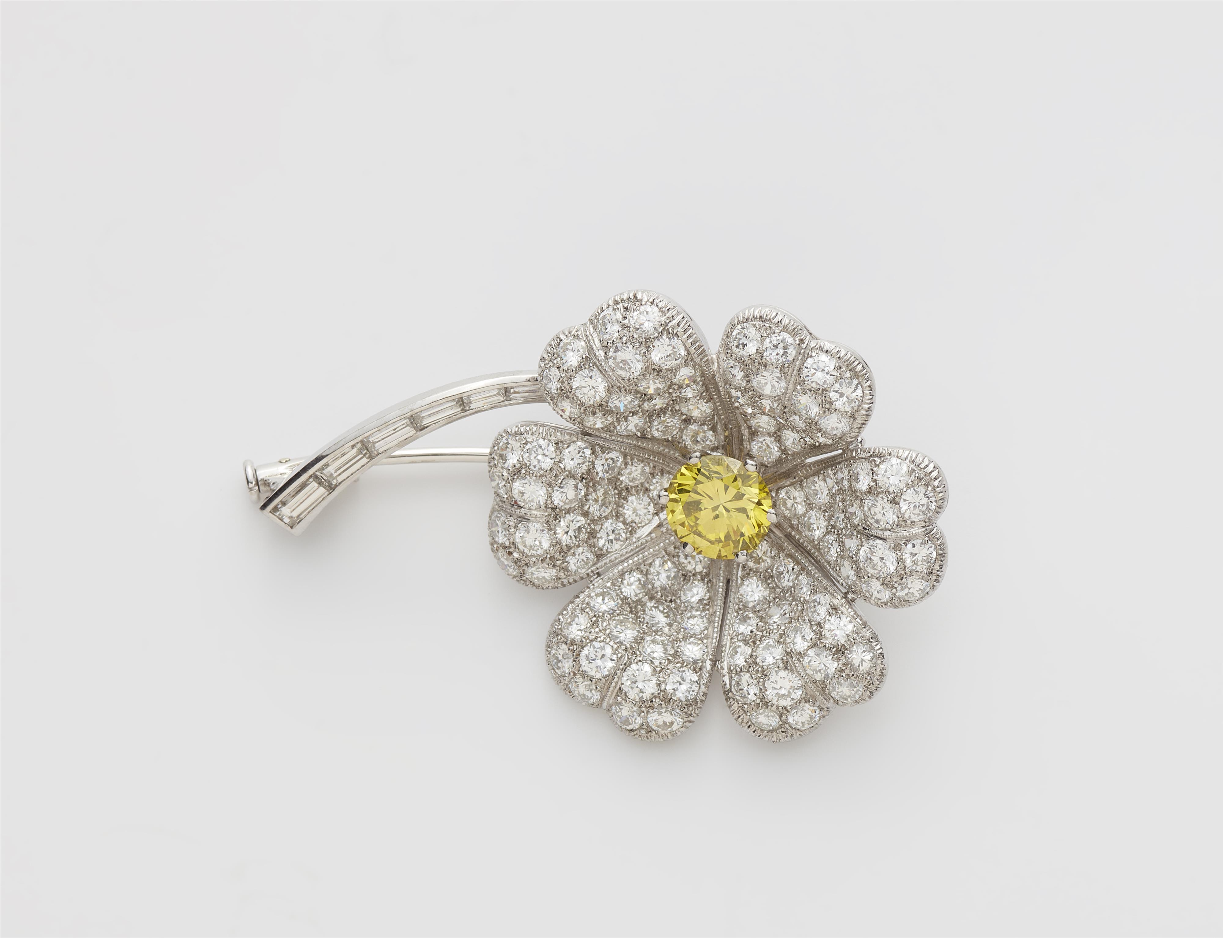 A platinum and diamond clover brooch with a treated lemon coloured brilliant-cut centre stone c. 1.30 ct. - image-1