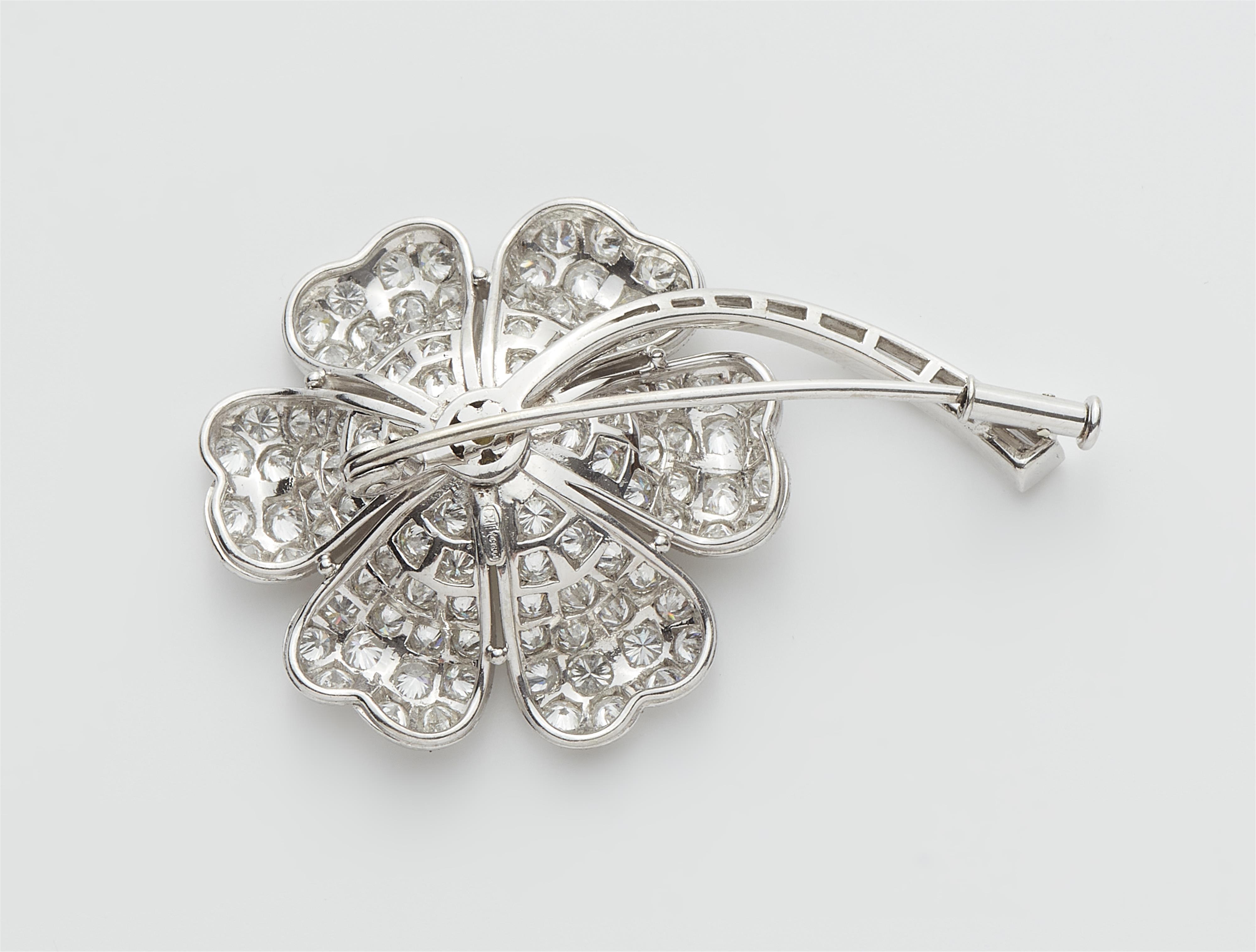 A platinum and diamond clover brooch with a treated lemon coloured brilliant-cut centre stone c. 1.30 ct. - image-2