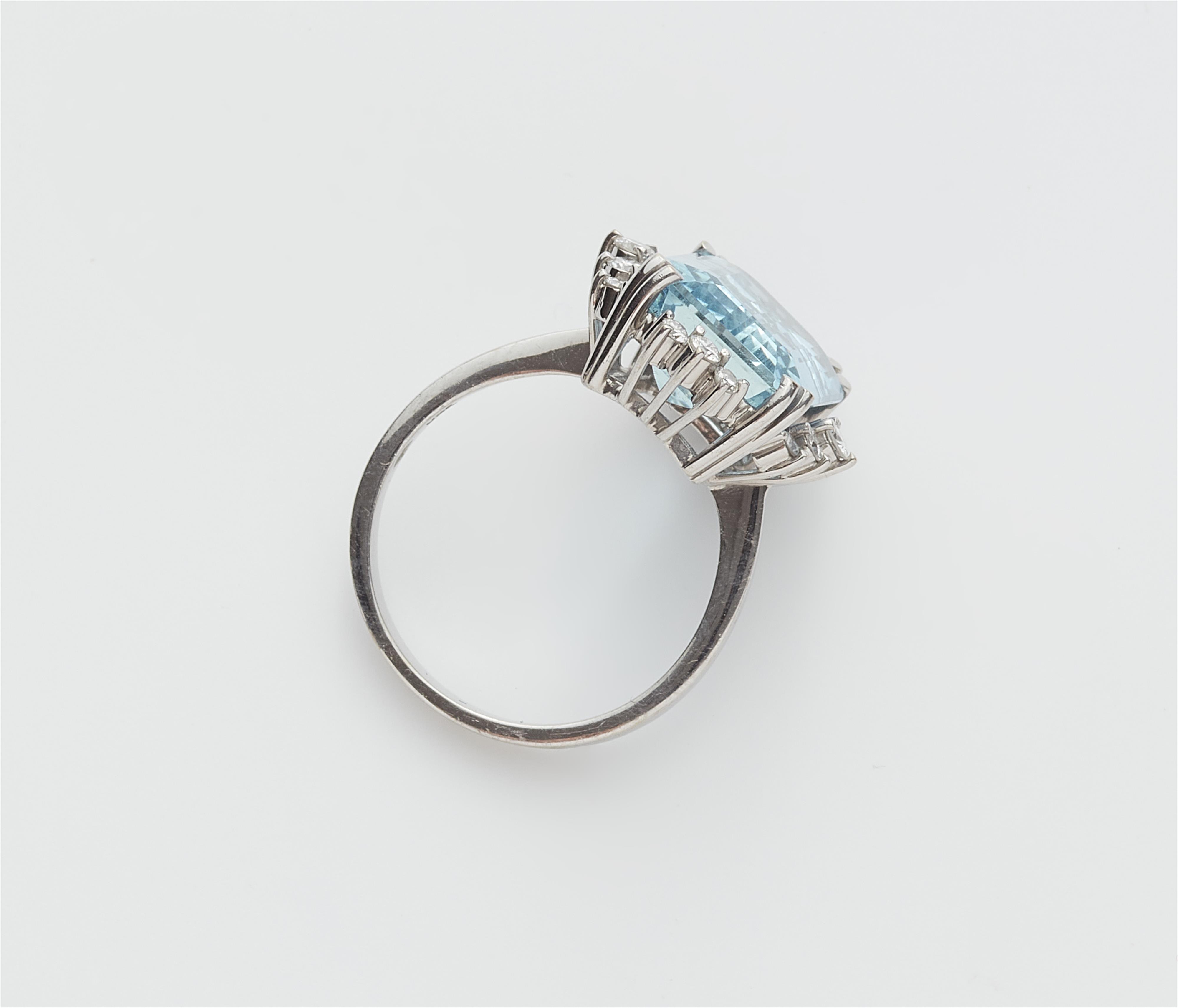 An 18k white gold aquamarine and diamond ring. - image-2