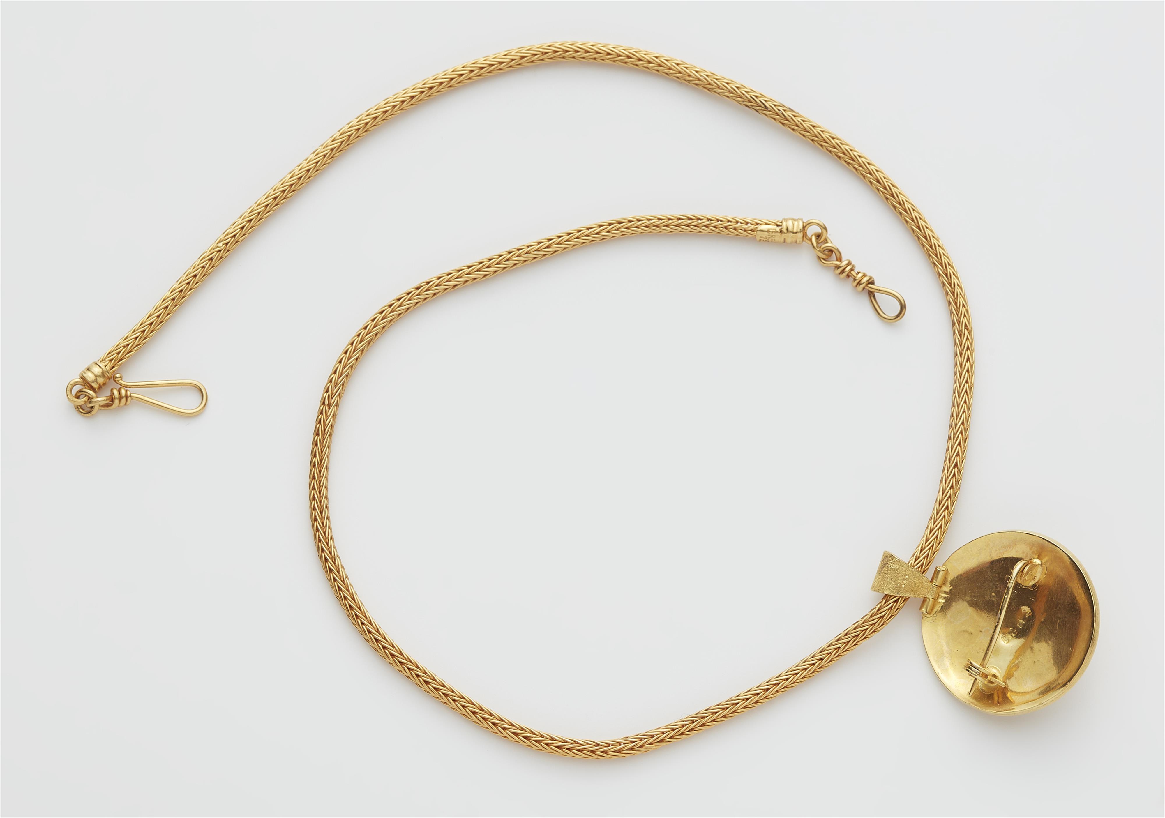 A Greek 18k gold necklace with a granulation and ruby disc pendant. - image-2