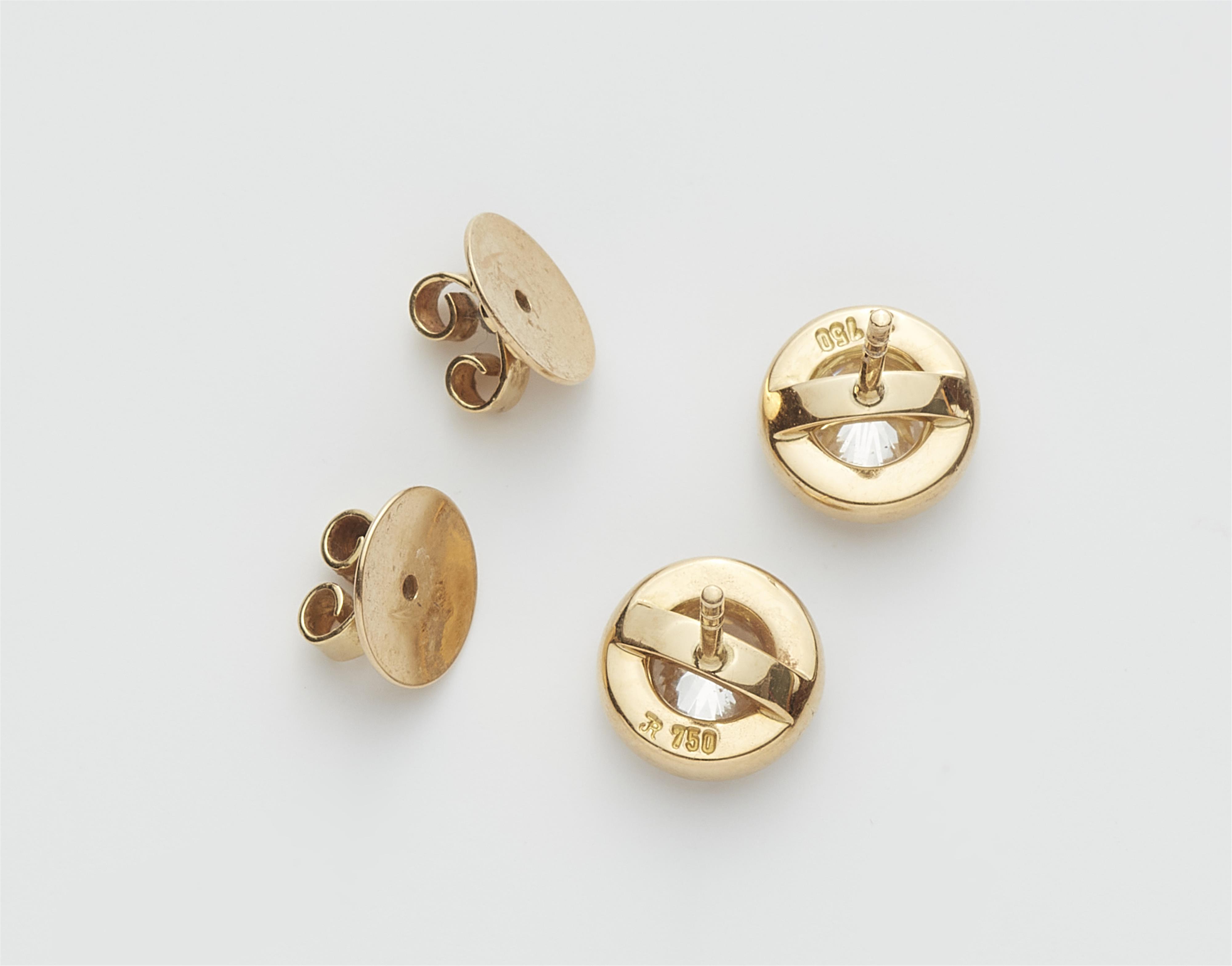 A pair of 18k yellow gold and diamond stud earrings. - image-2