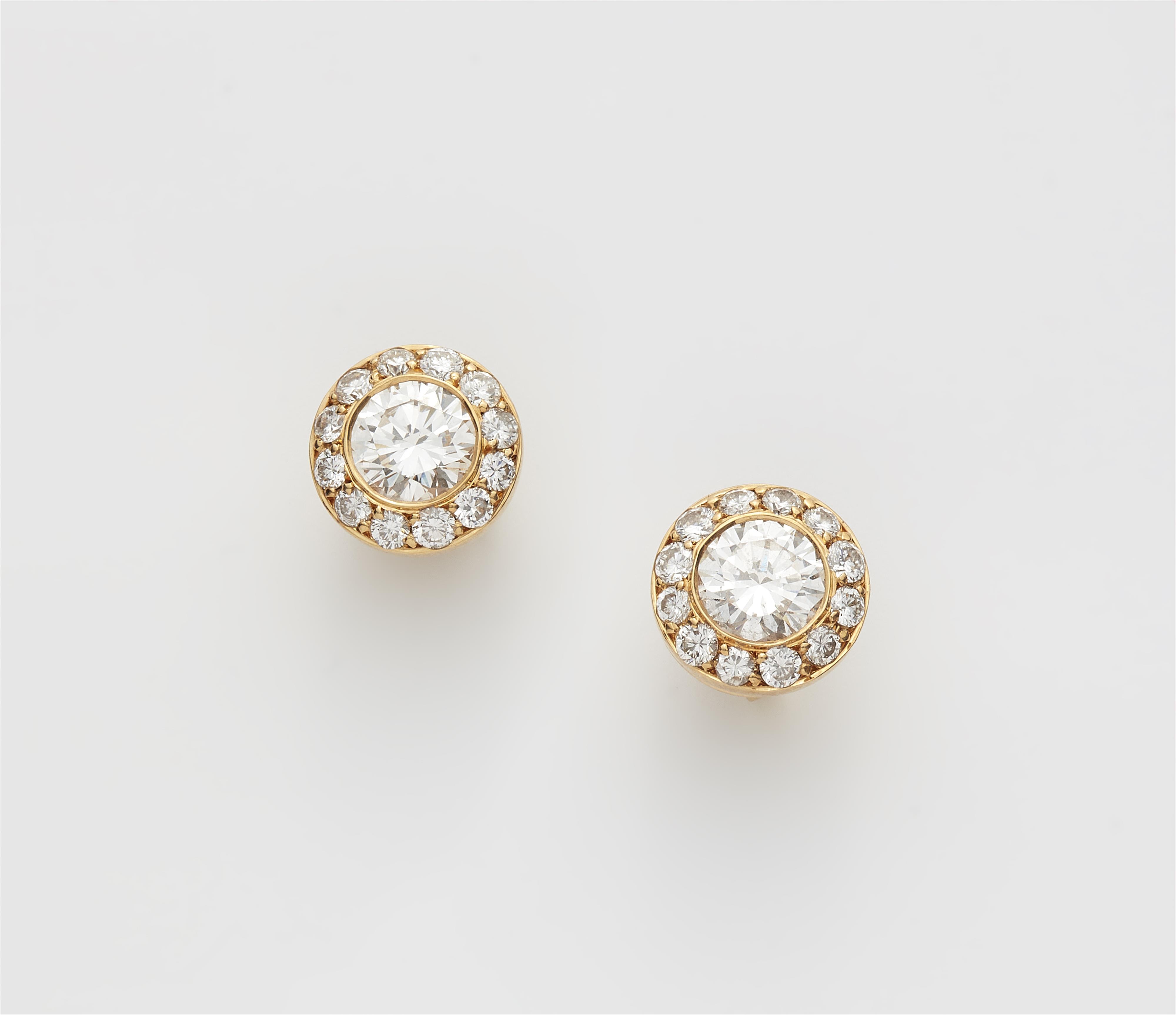 A pair of 18k yellow gold and diamond stud earrings. - image-1