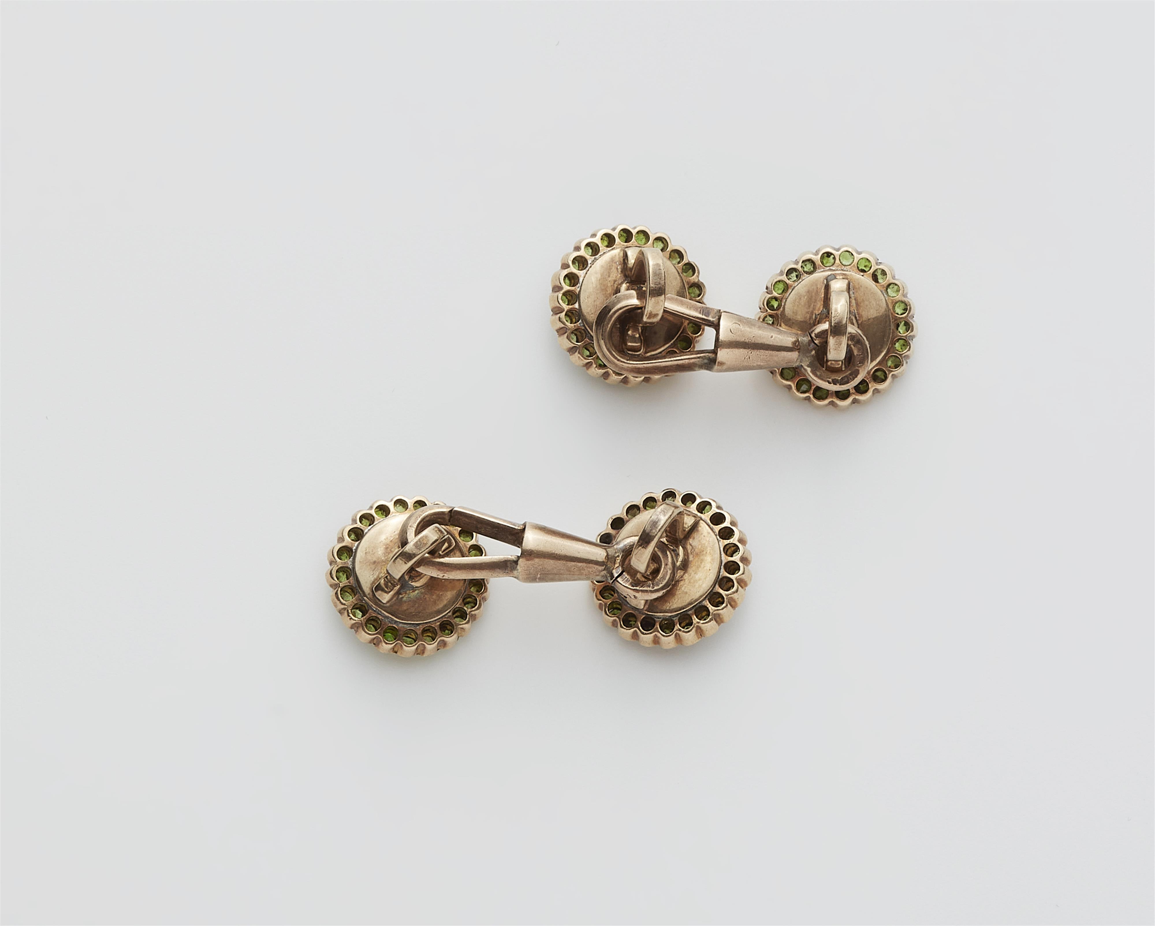 A pair of Austrian mother of pearl diamond and demantoid cufflinks. - image-2